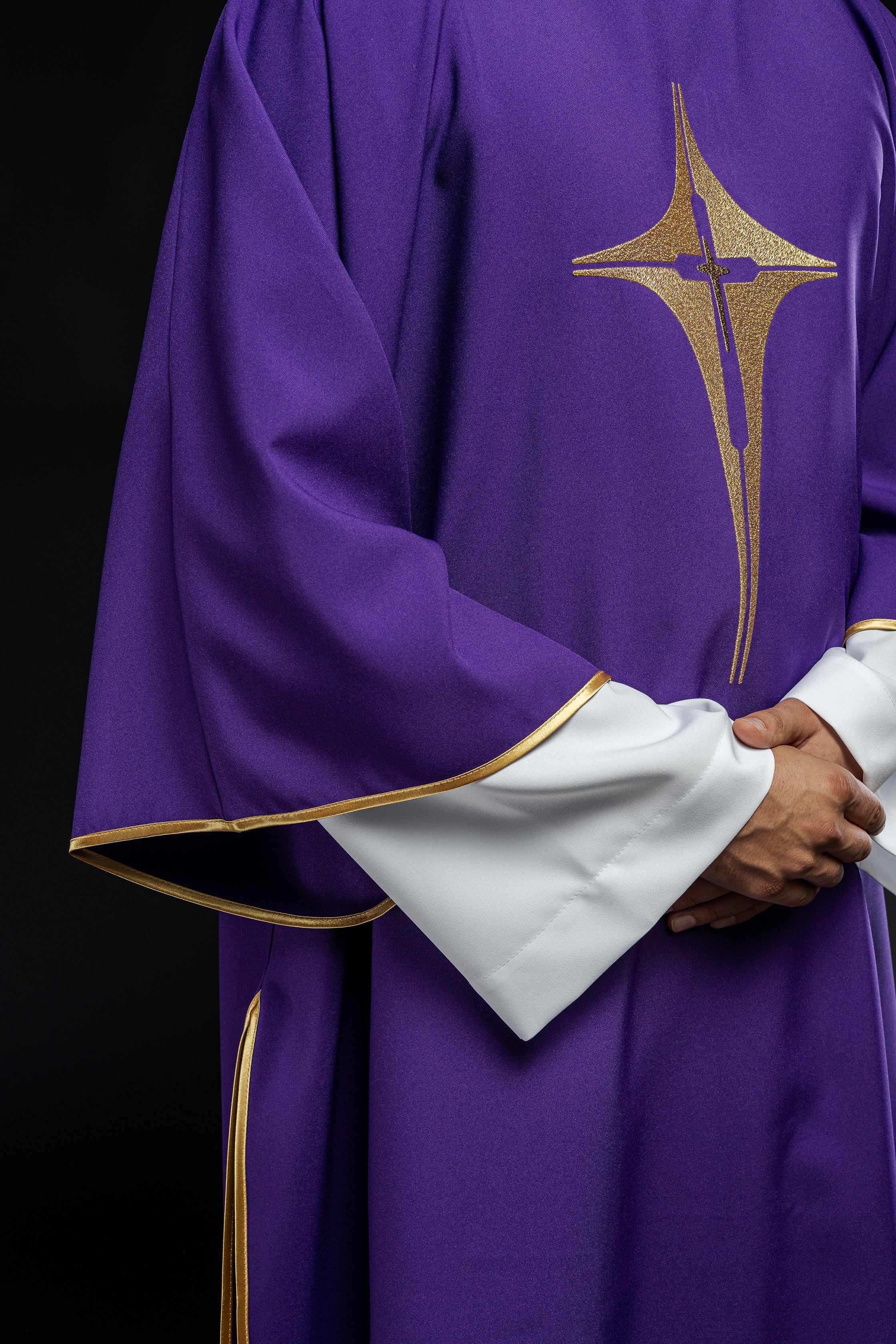 Purple liturgical dalmatic with embroidered gold cross