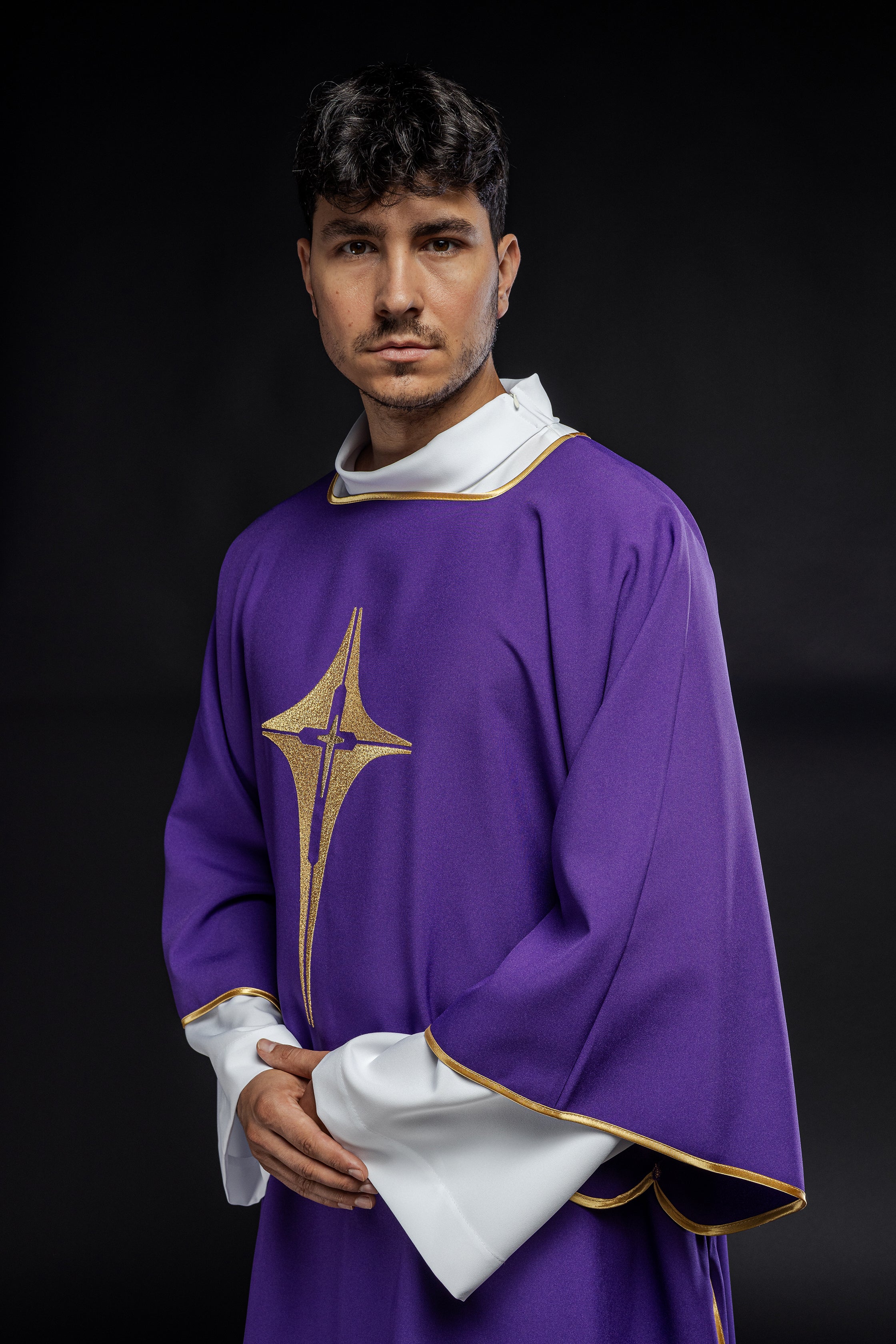 Purple liturgical dalmatic with embroidered gold cross