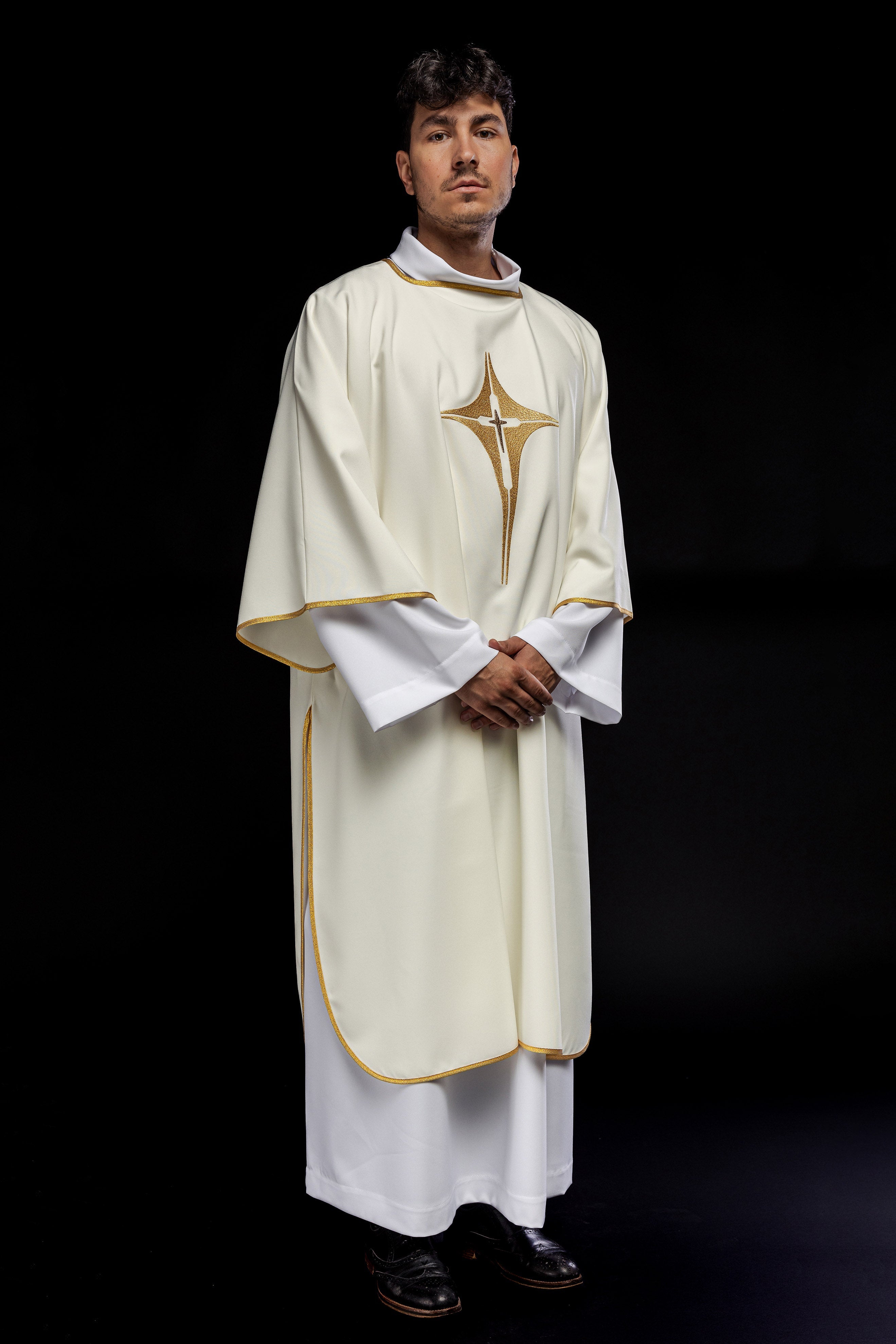 Ivory dalmatic chasuble with gold star-shaped cross