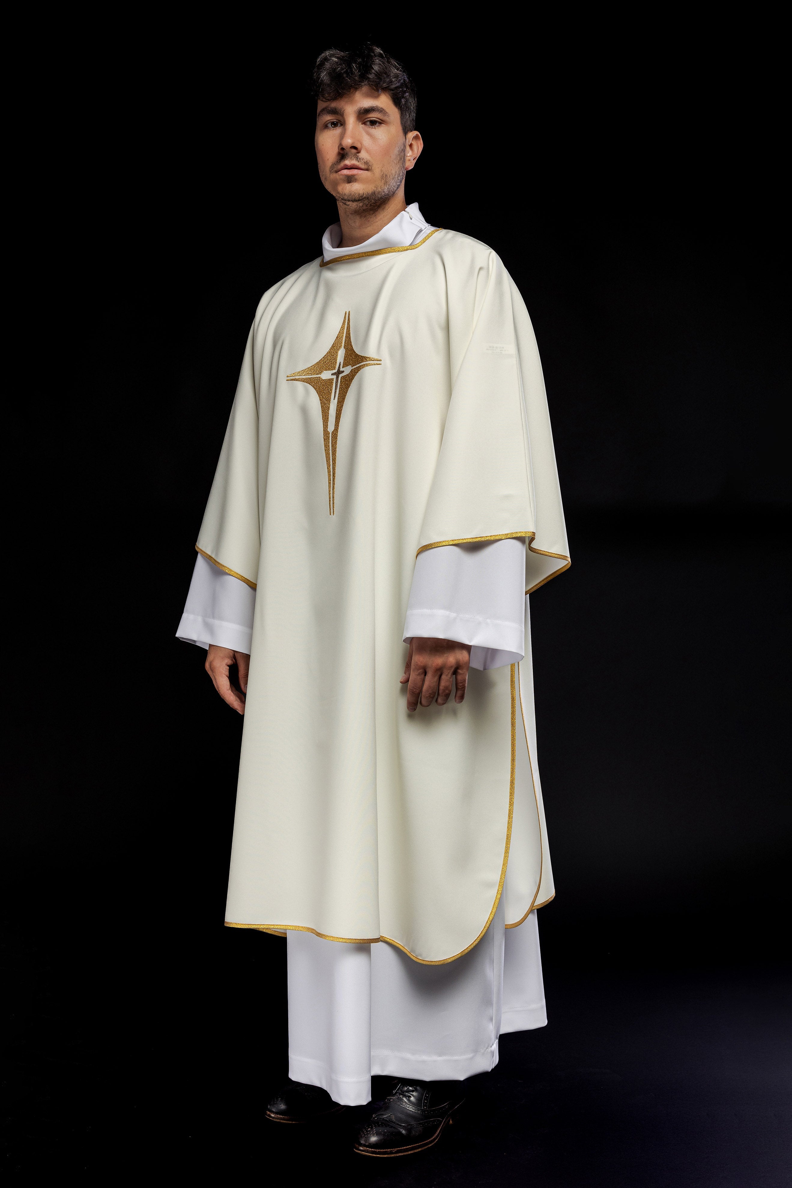 Ivory dalmatic chasuble with gold star-shaped cross