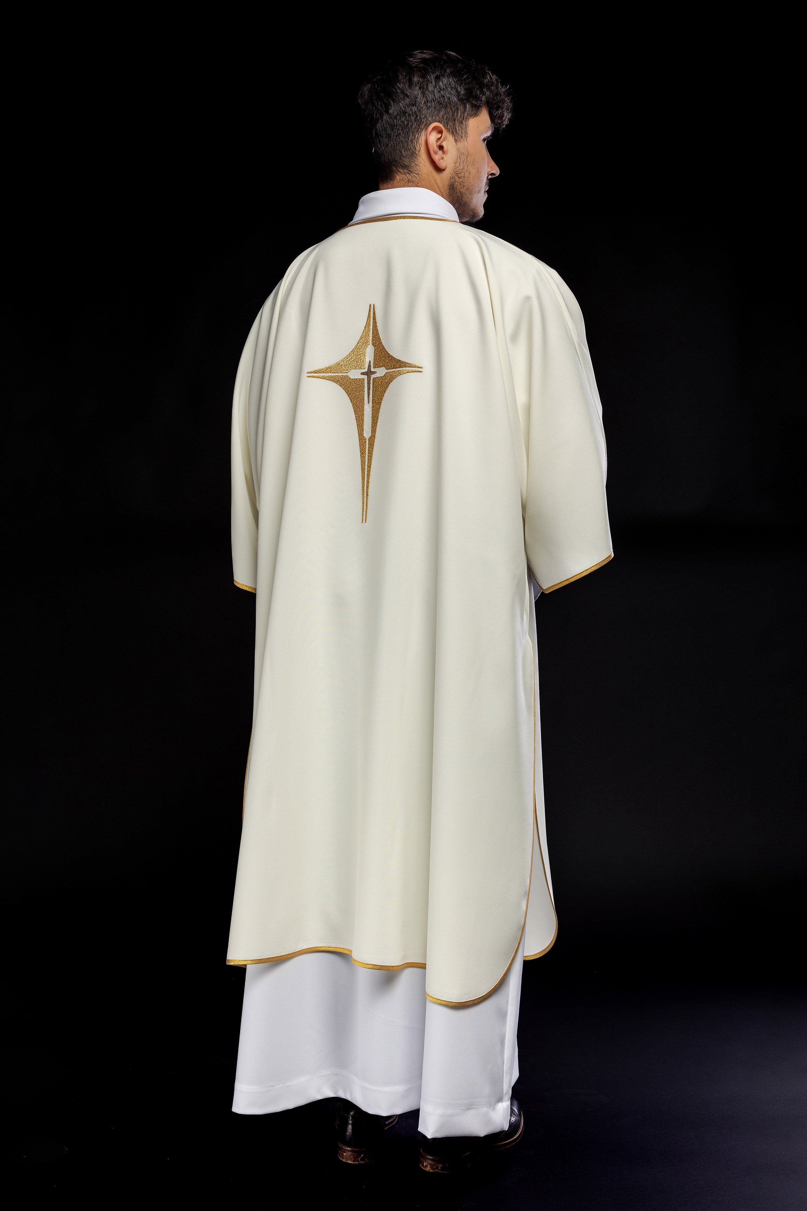 Ivory dalmatic chasuble with gold star-shaped cross