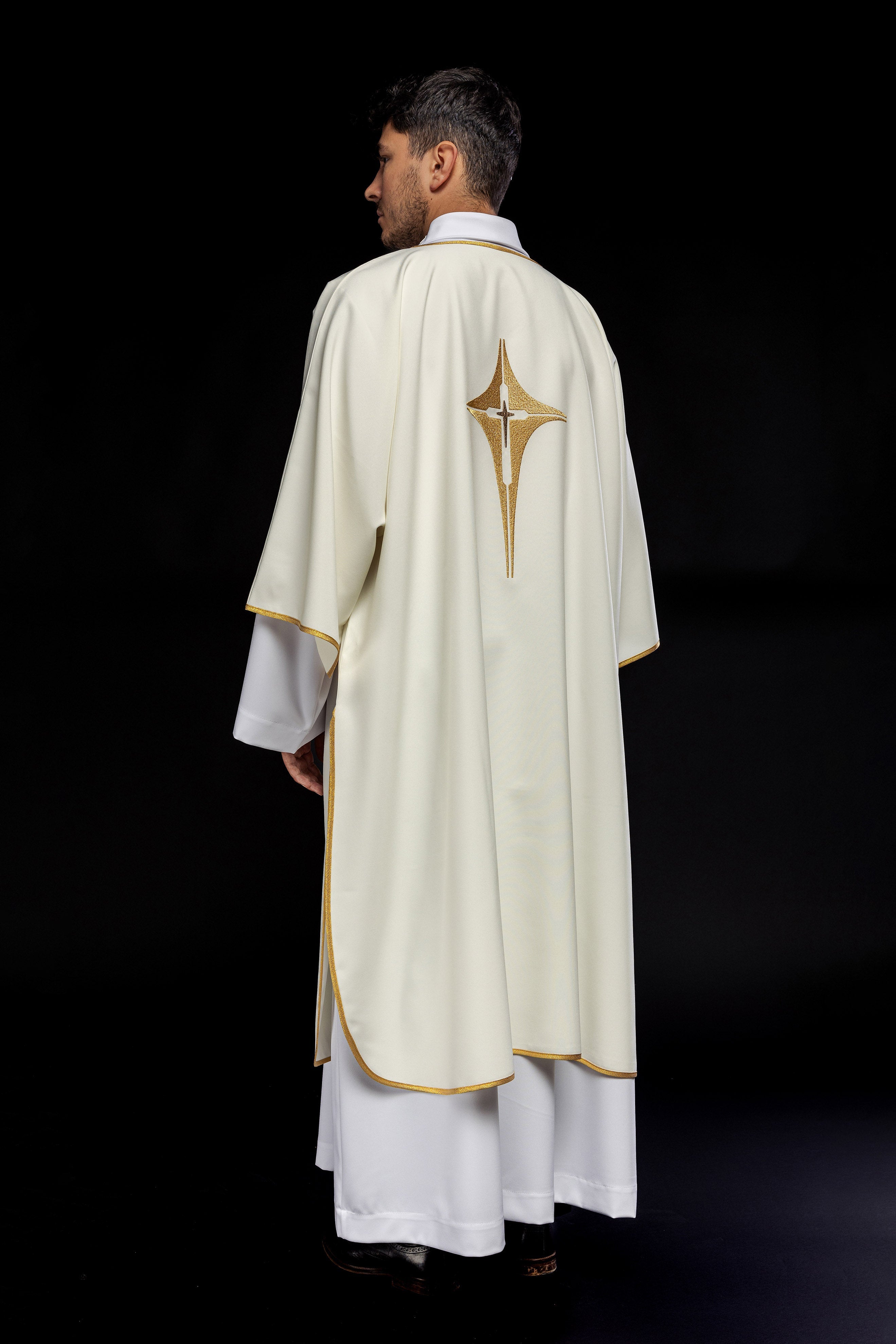 Ivory dalmatic chasuble with gold star-shaped cross