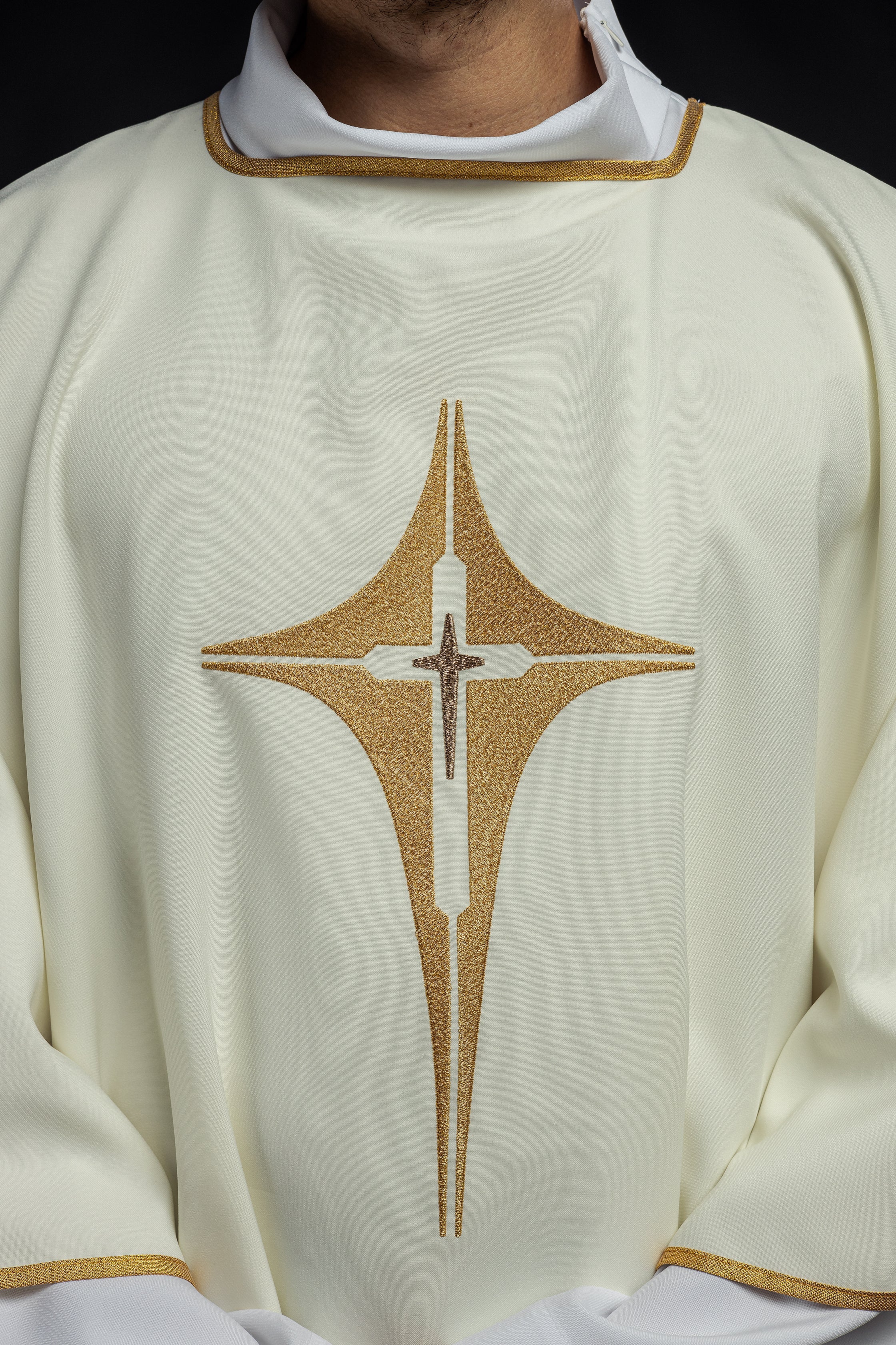 Ivory dalmatic chasuble with gold star-shaped cross