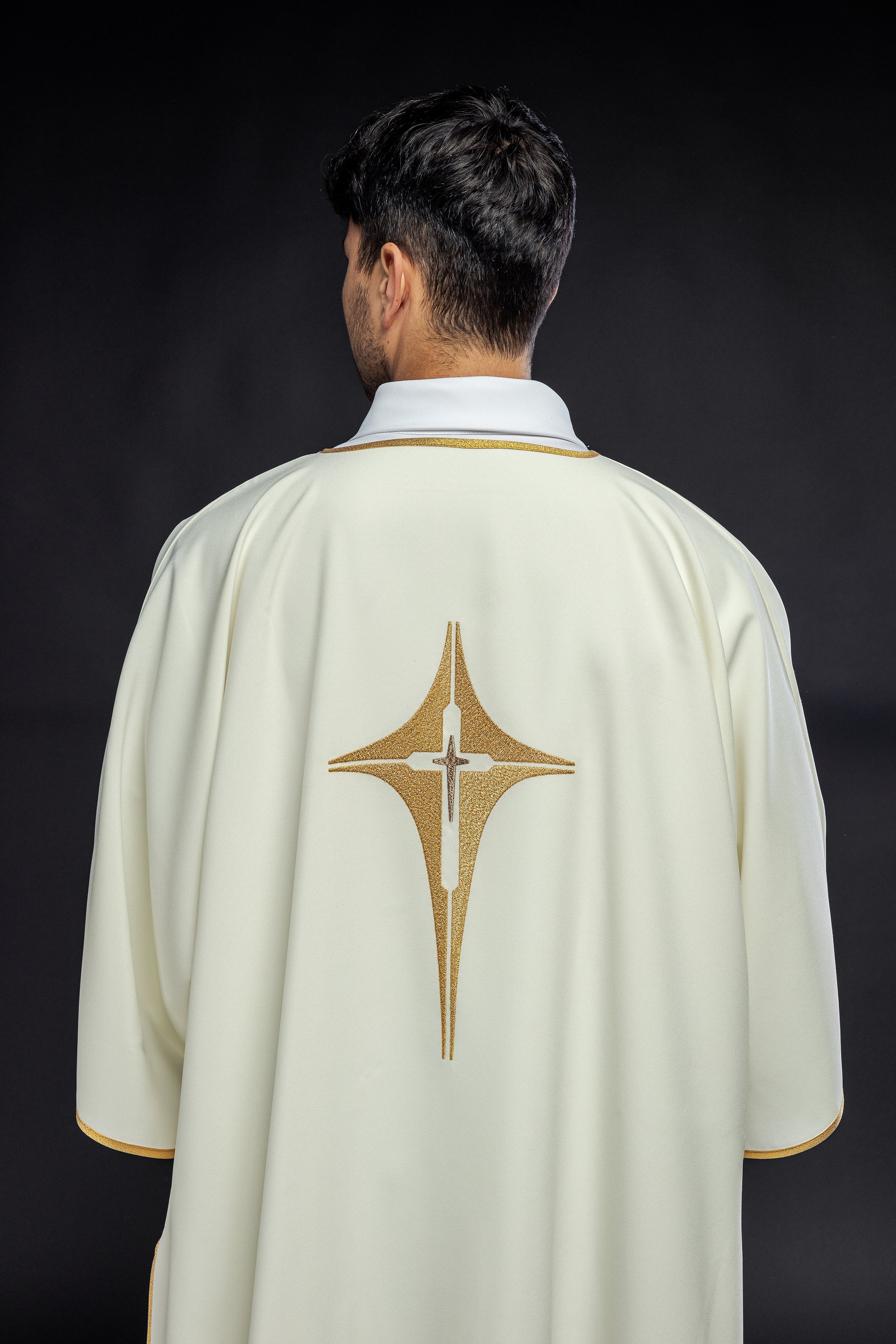 Ivory dalmatic chasuble with gold star-shaped cross