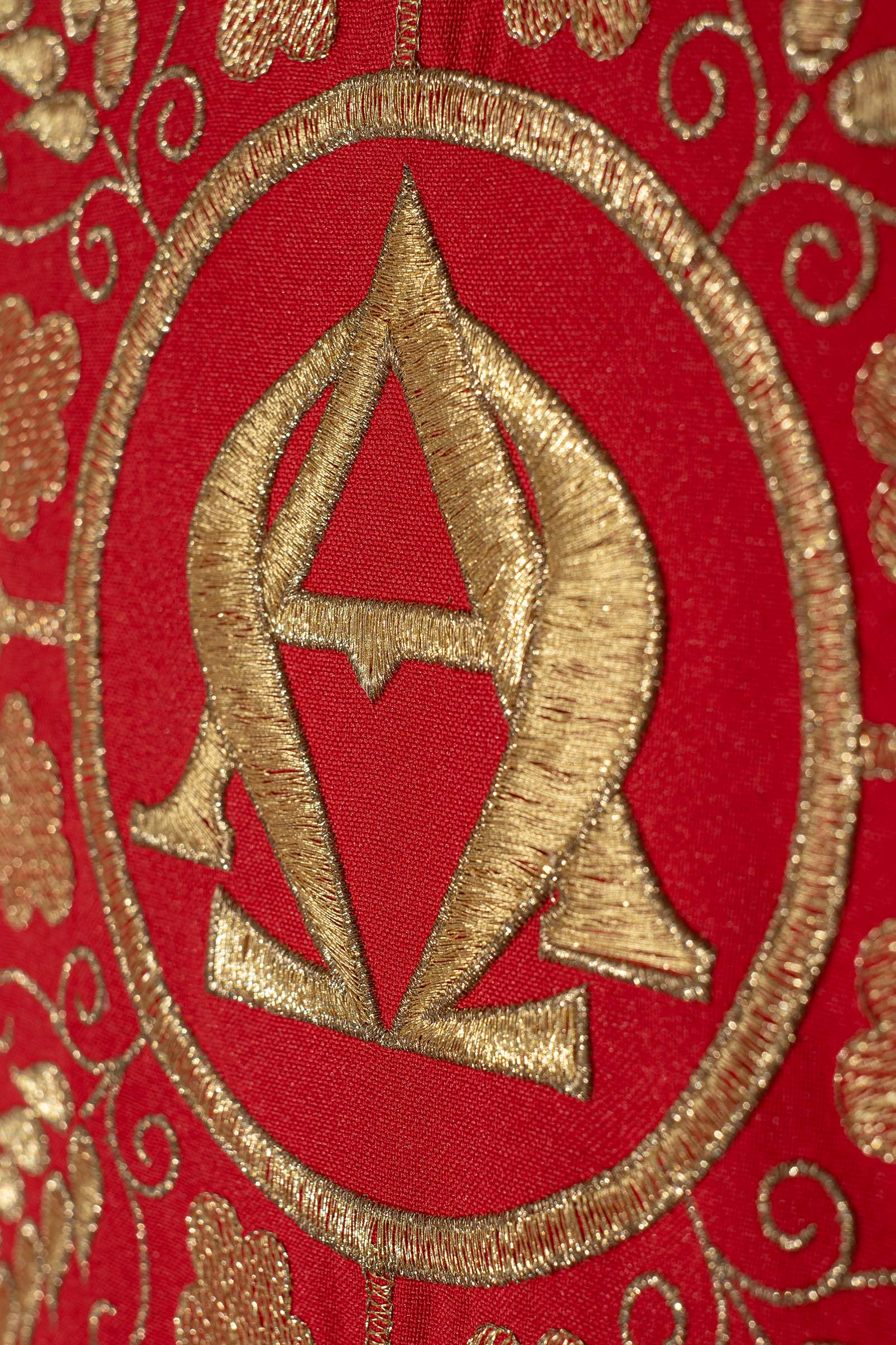 Embroidered red chasuble with Alpha and Omega symbols and wheat motifs