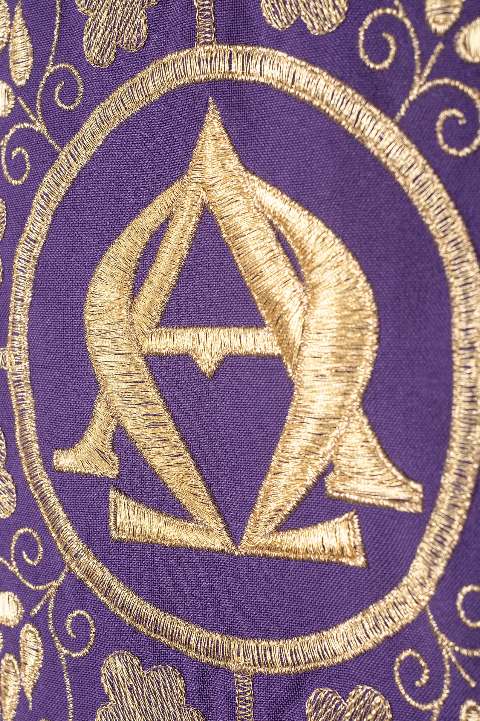 Embroidered purple chasuble with Alpha and Omega symbols and wheat motifs