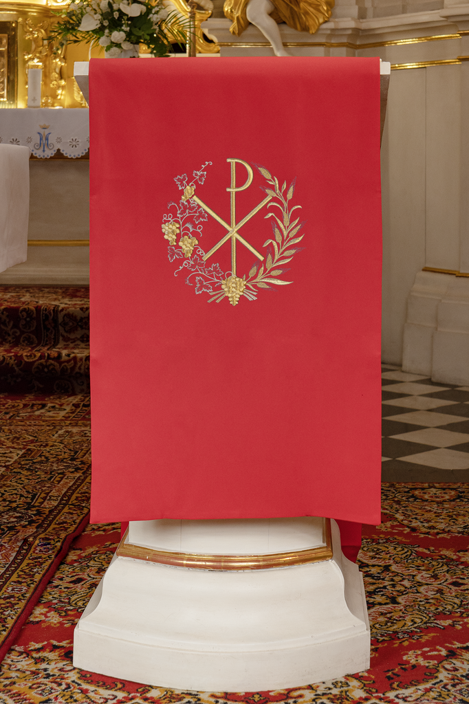 Lectern cover embroidered with a PAX motif in red
