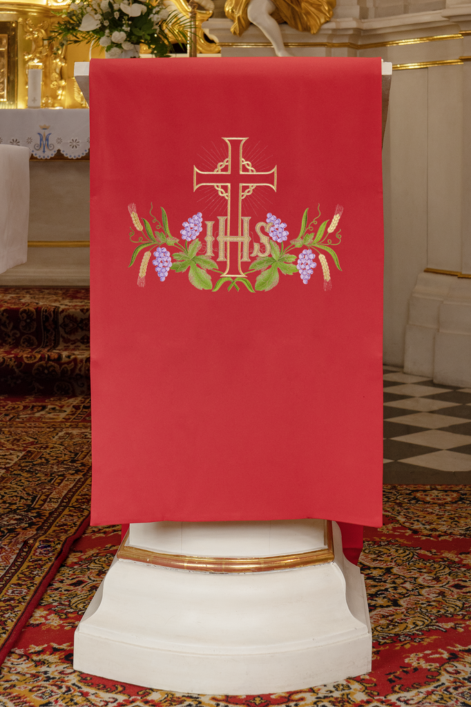 Lectern cover embroidered with an IHS and Cross motif in red