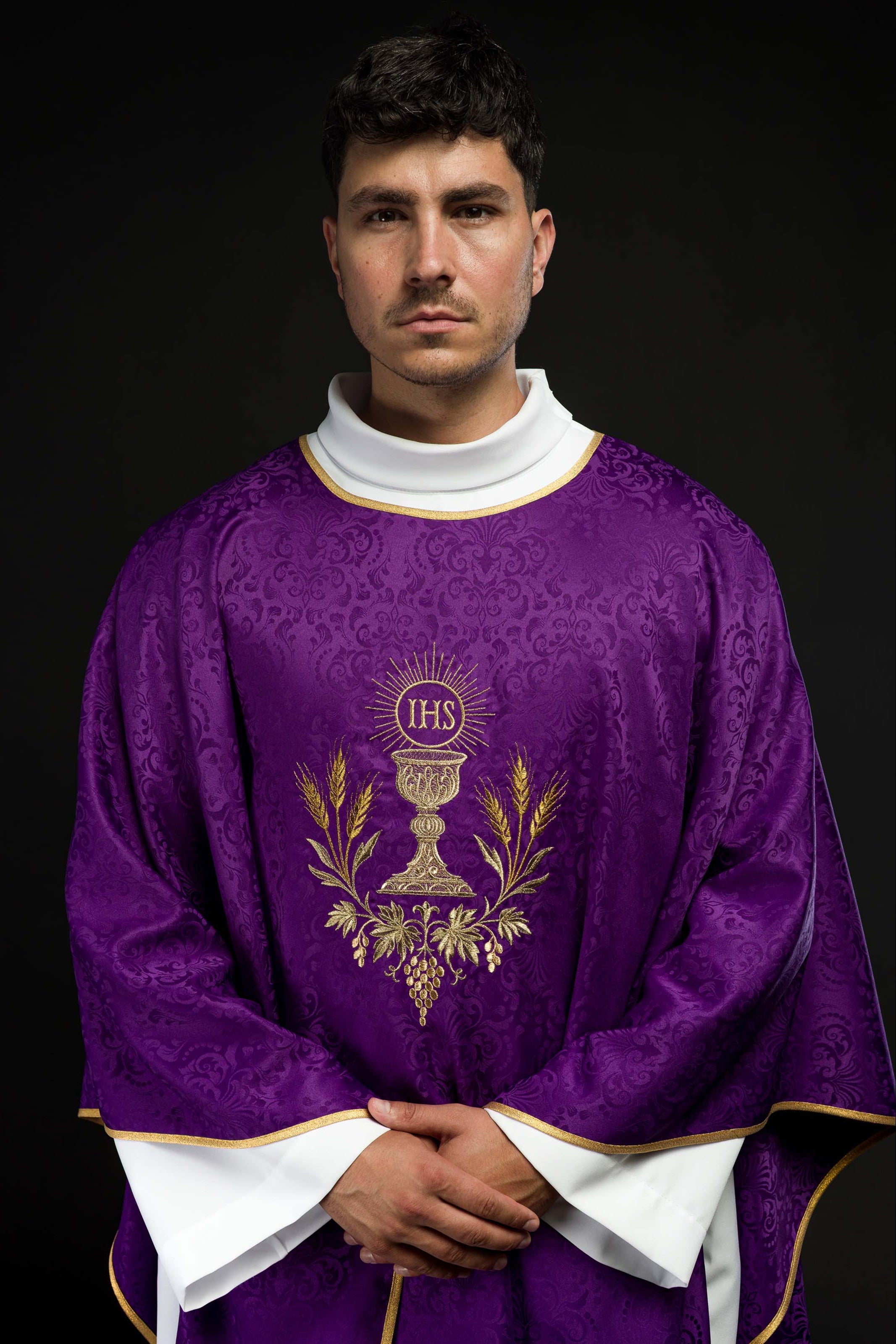 Purple liturgical chasuble with embroidered chalice and host on jacquard fabric