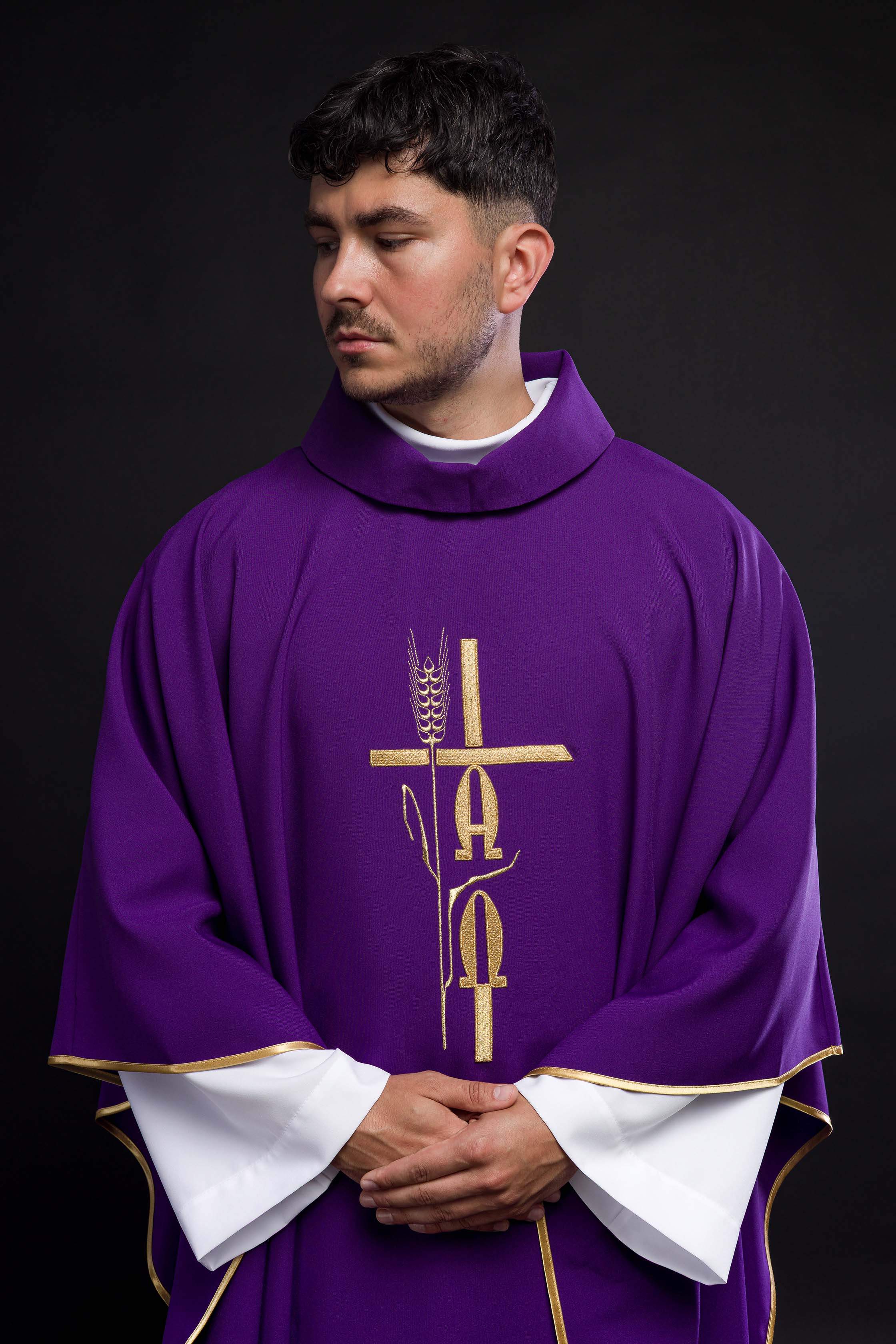 Purple chasuble with cross and alfa omega symbols