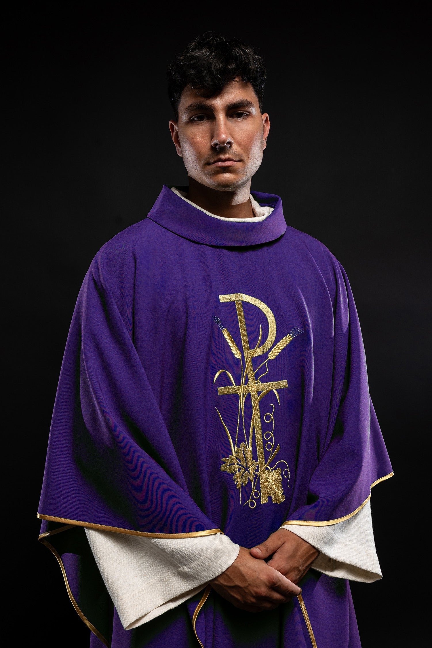 Purple chasuble with golden cross embroidery