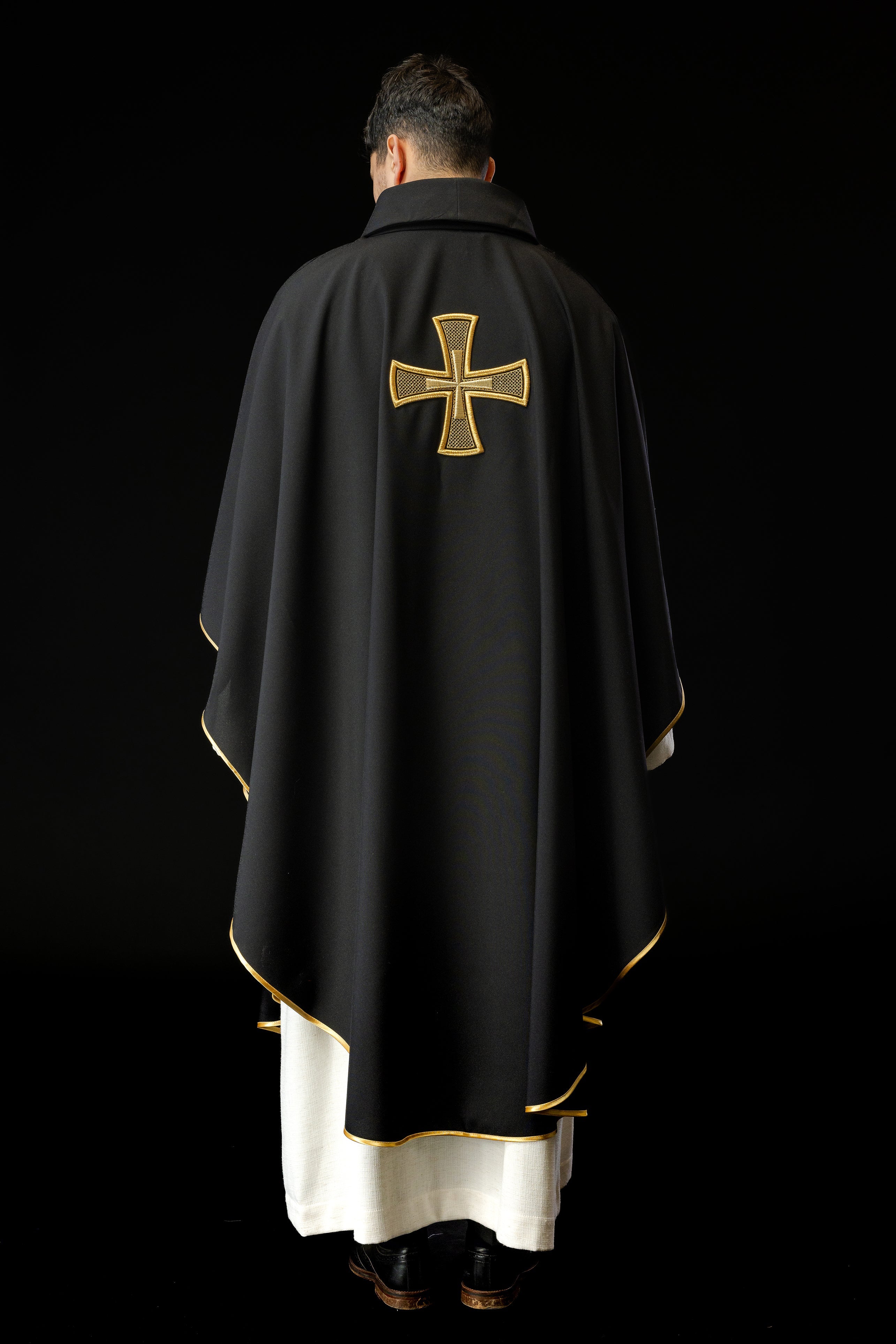 Black chasuble with gold cross