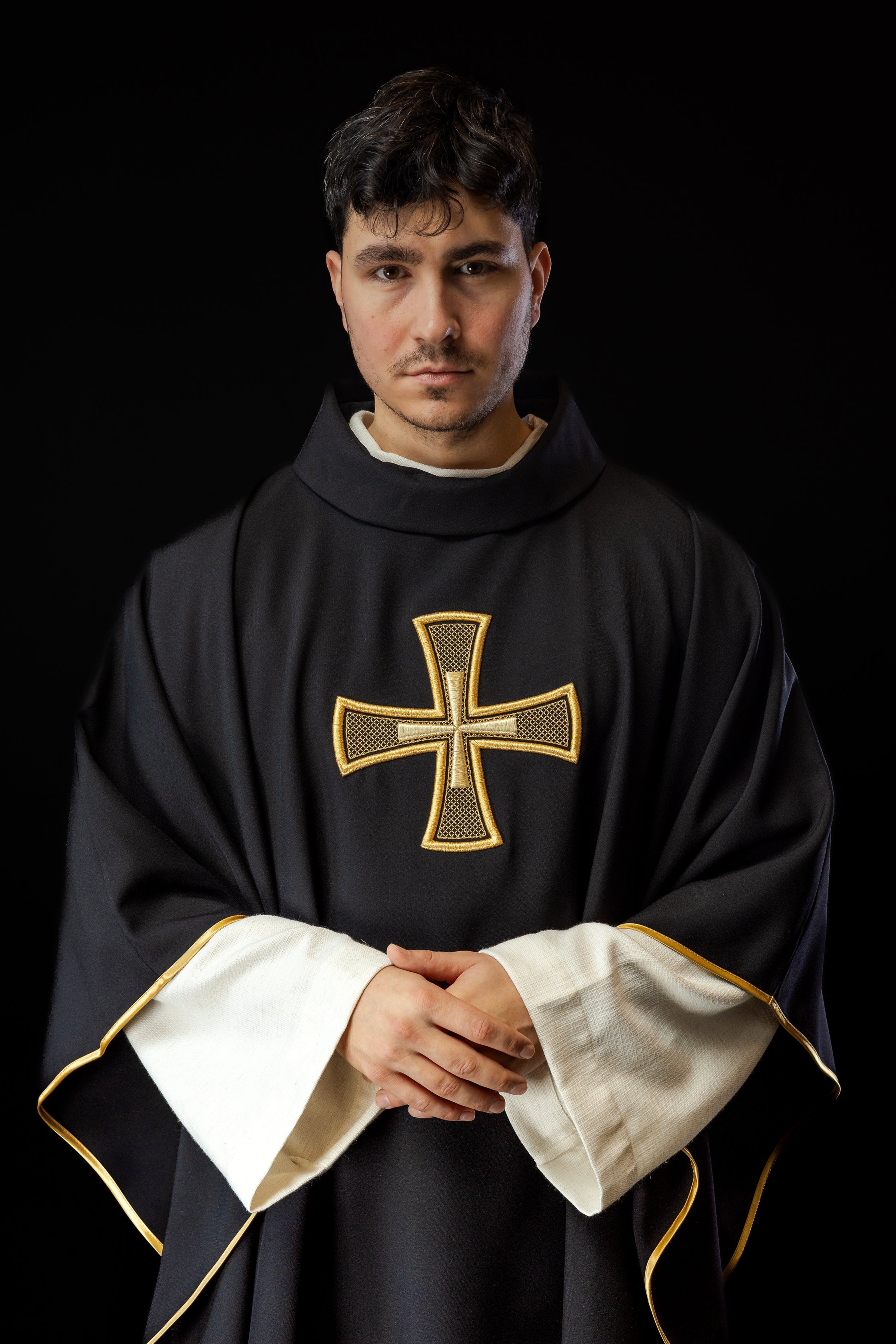 Black chasuble with gold cross