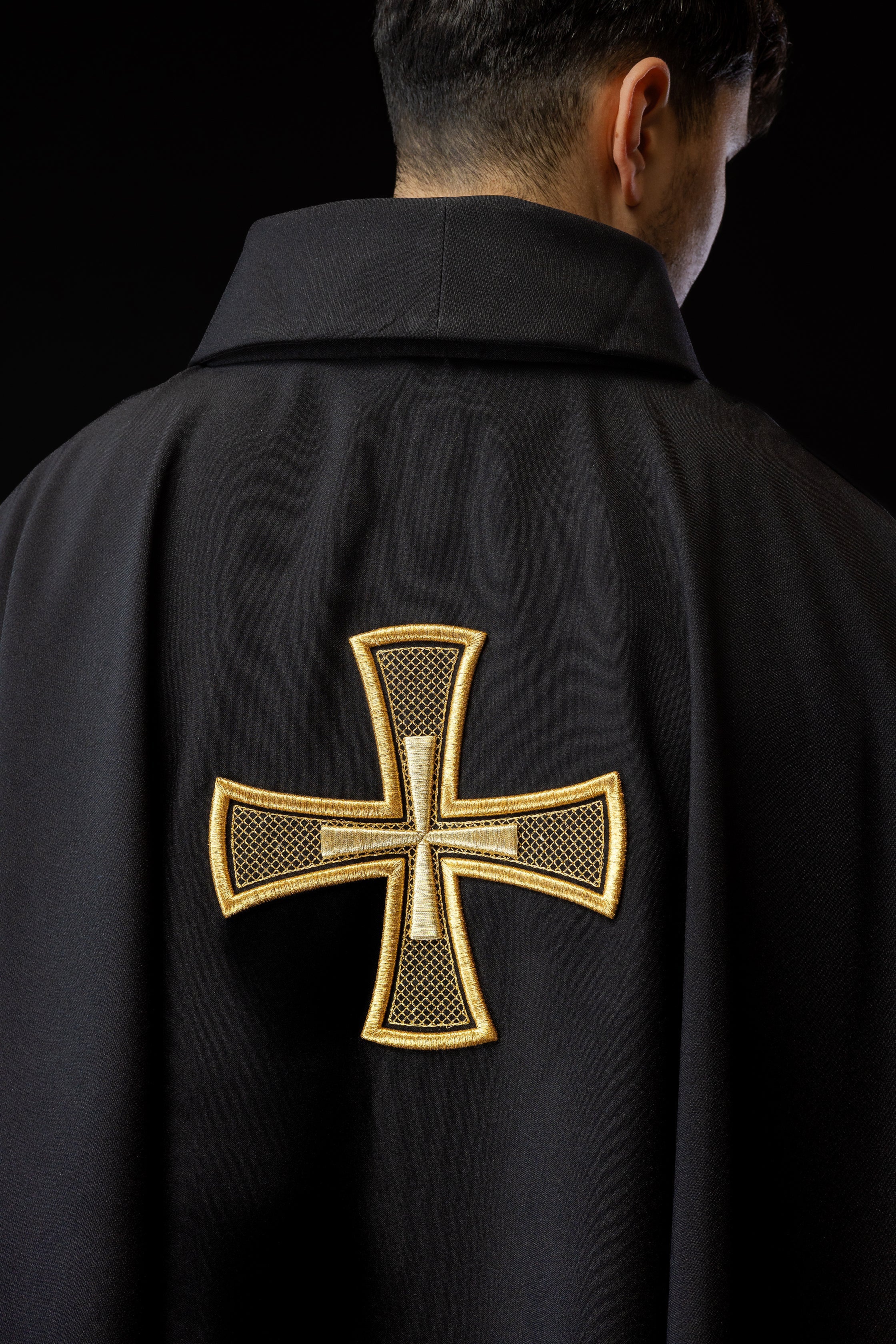 Black chasuble with gold cross