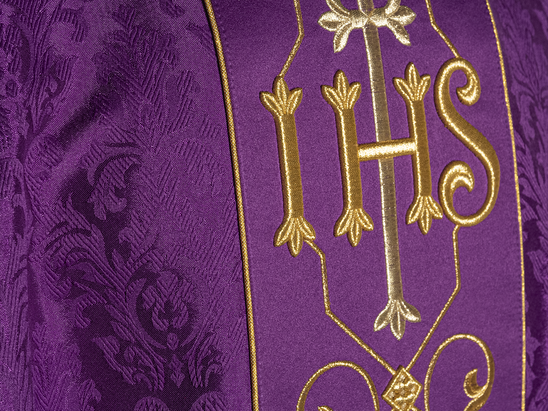 Richly embroidered purple IHS chasuble