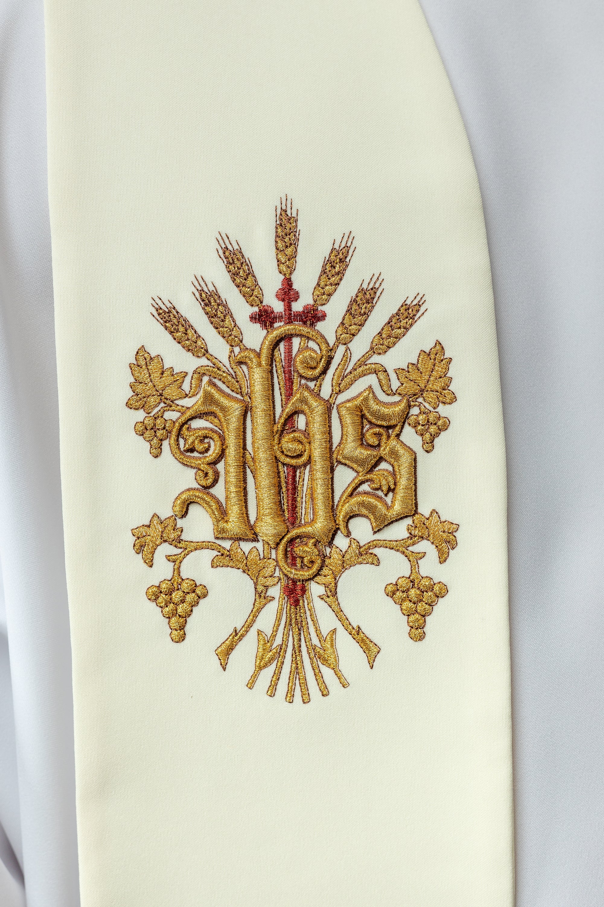 Ecru embroidered stole with a cross, IHS, and the heart of Jesus Christ