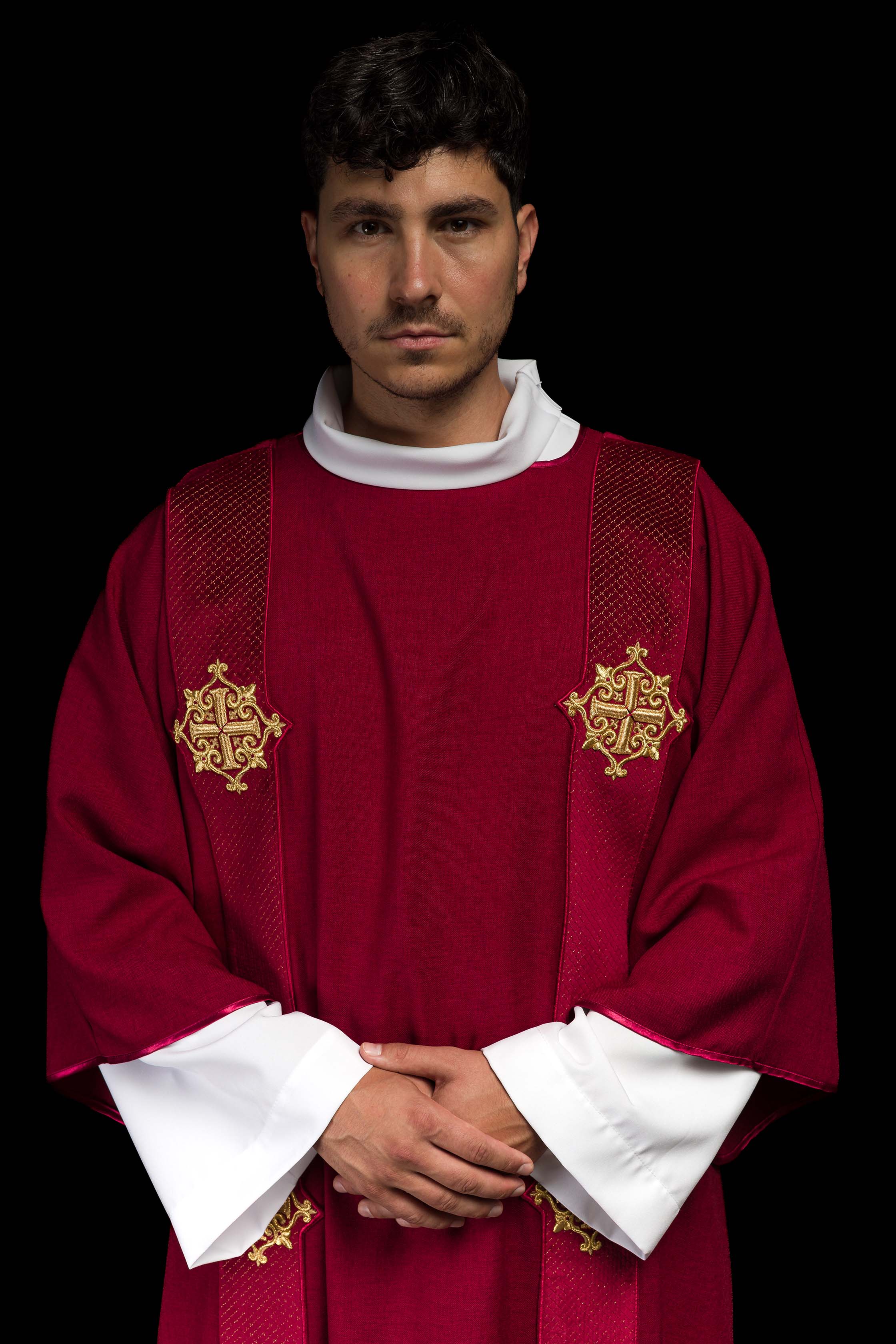 Red dalmatic with velvet bands and cross symbols