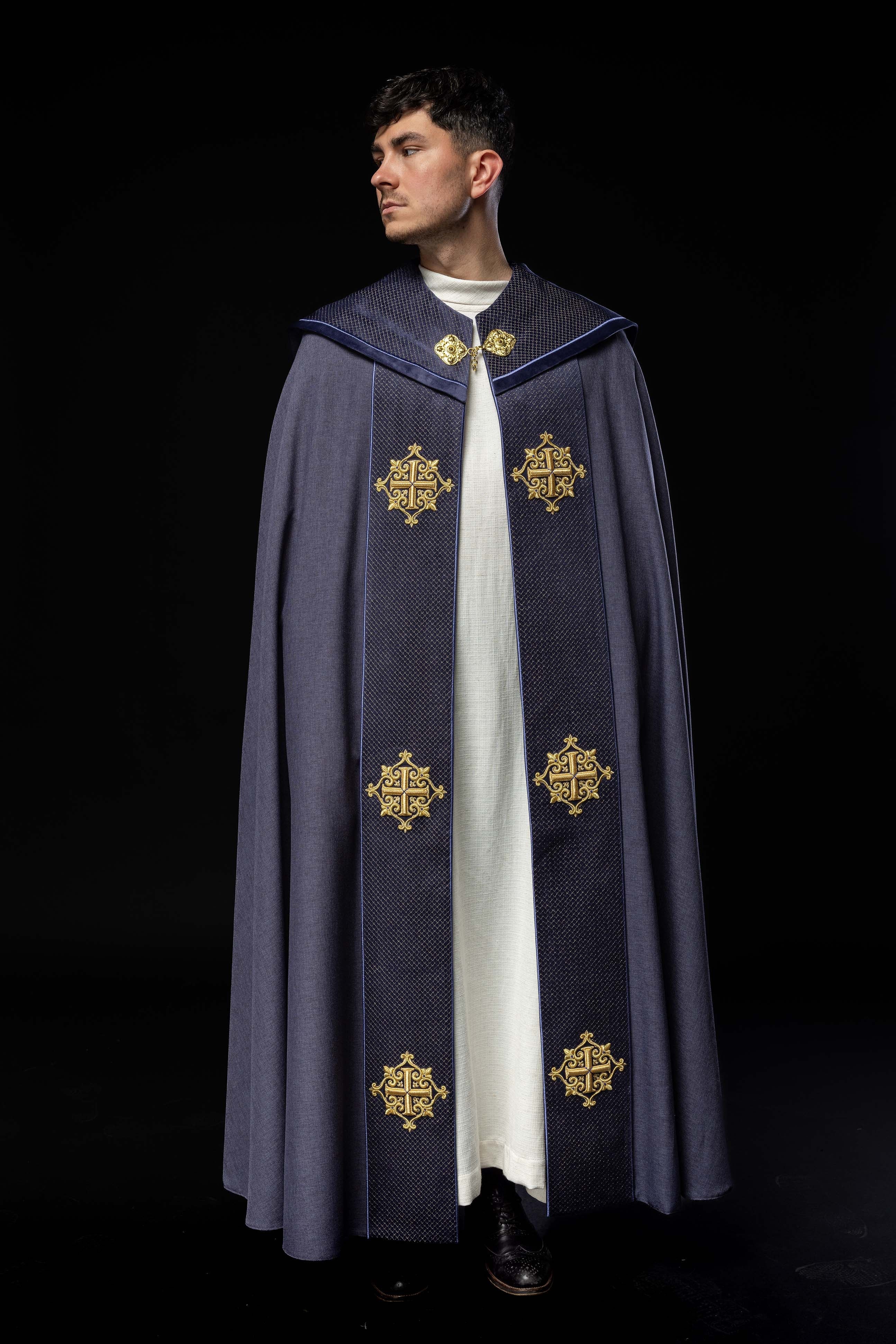 Purple cope with a velvet sash and cross embroidery