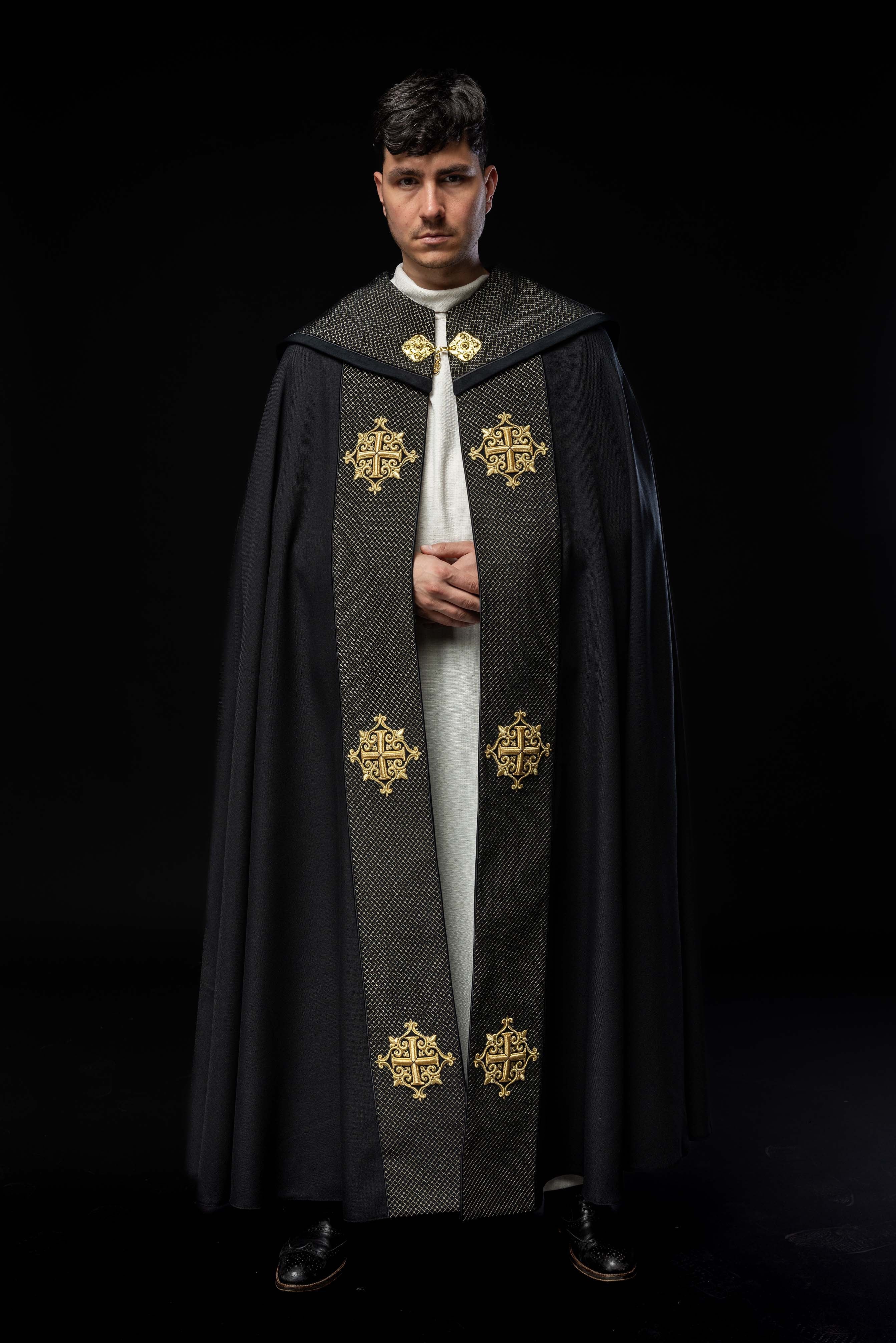 Black cope with a velvet sash and cross embroidery