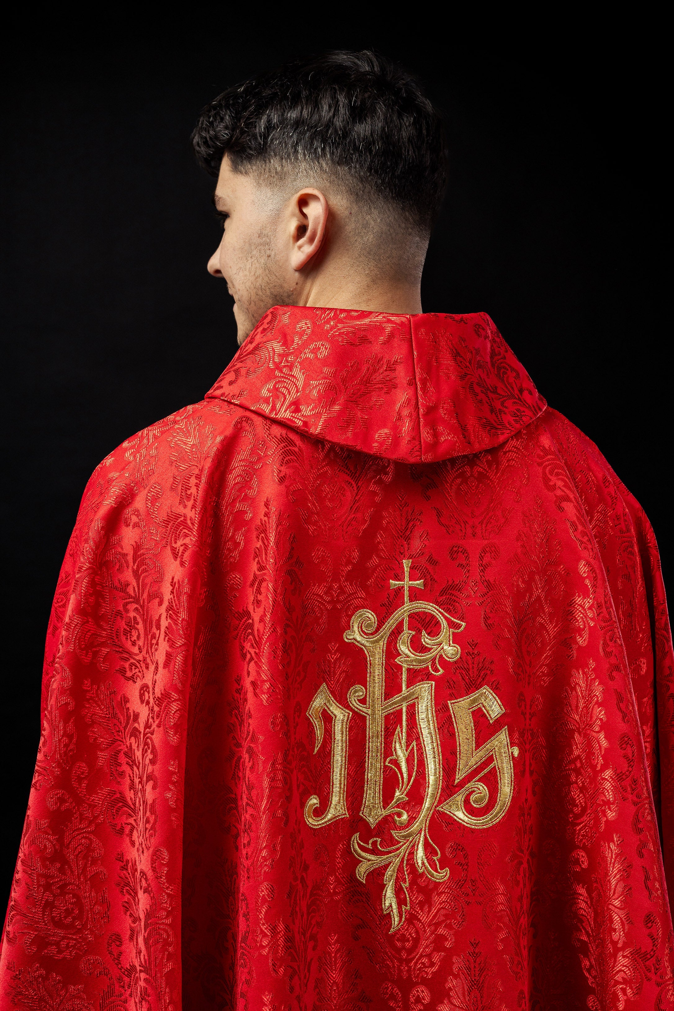 Red chasuble made of floral texture with classic IHS