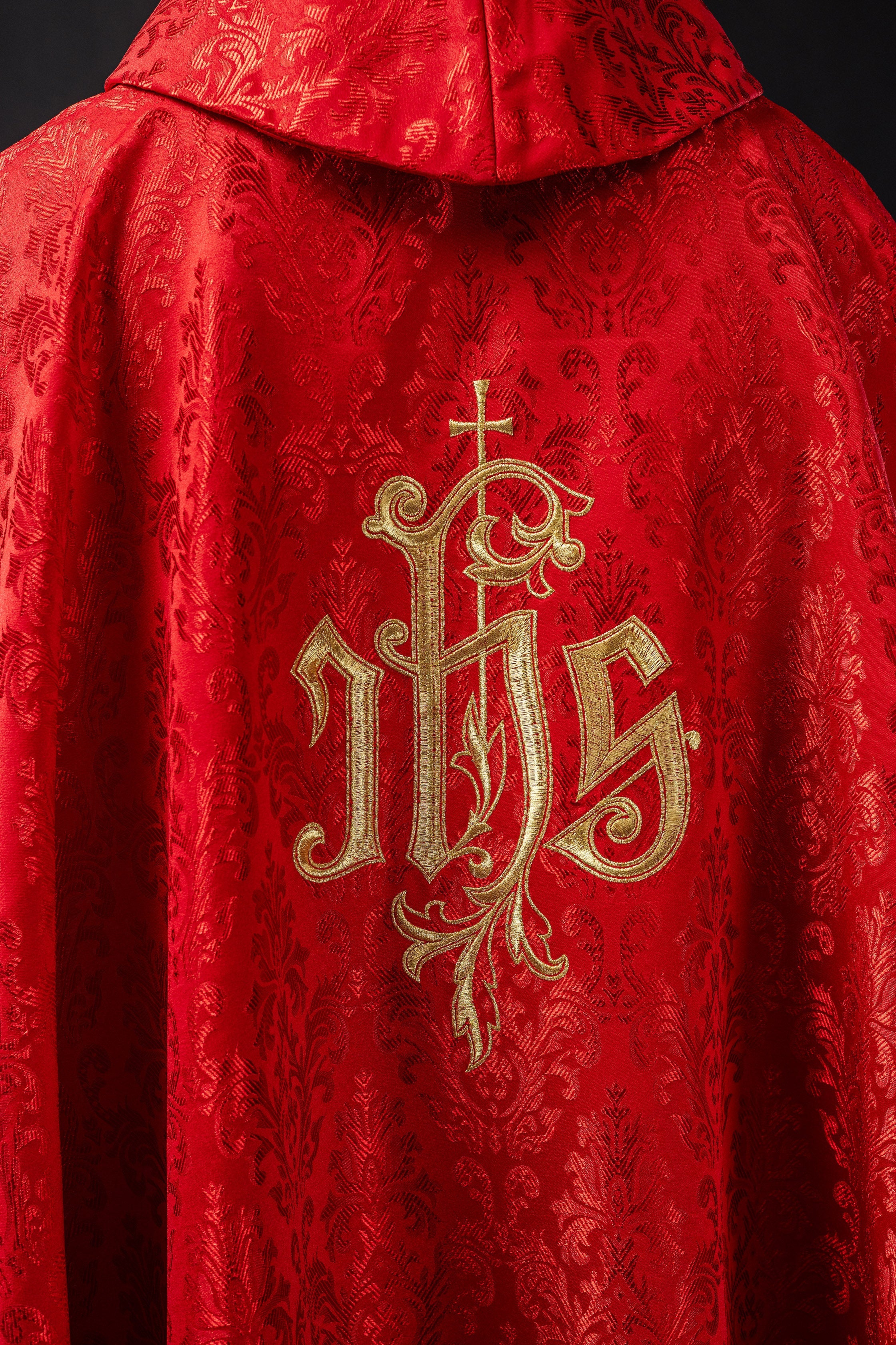 Red chasuble made of floral texture with classic IHS