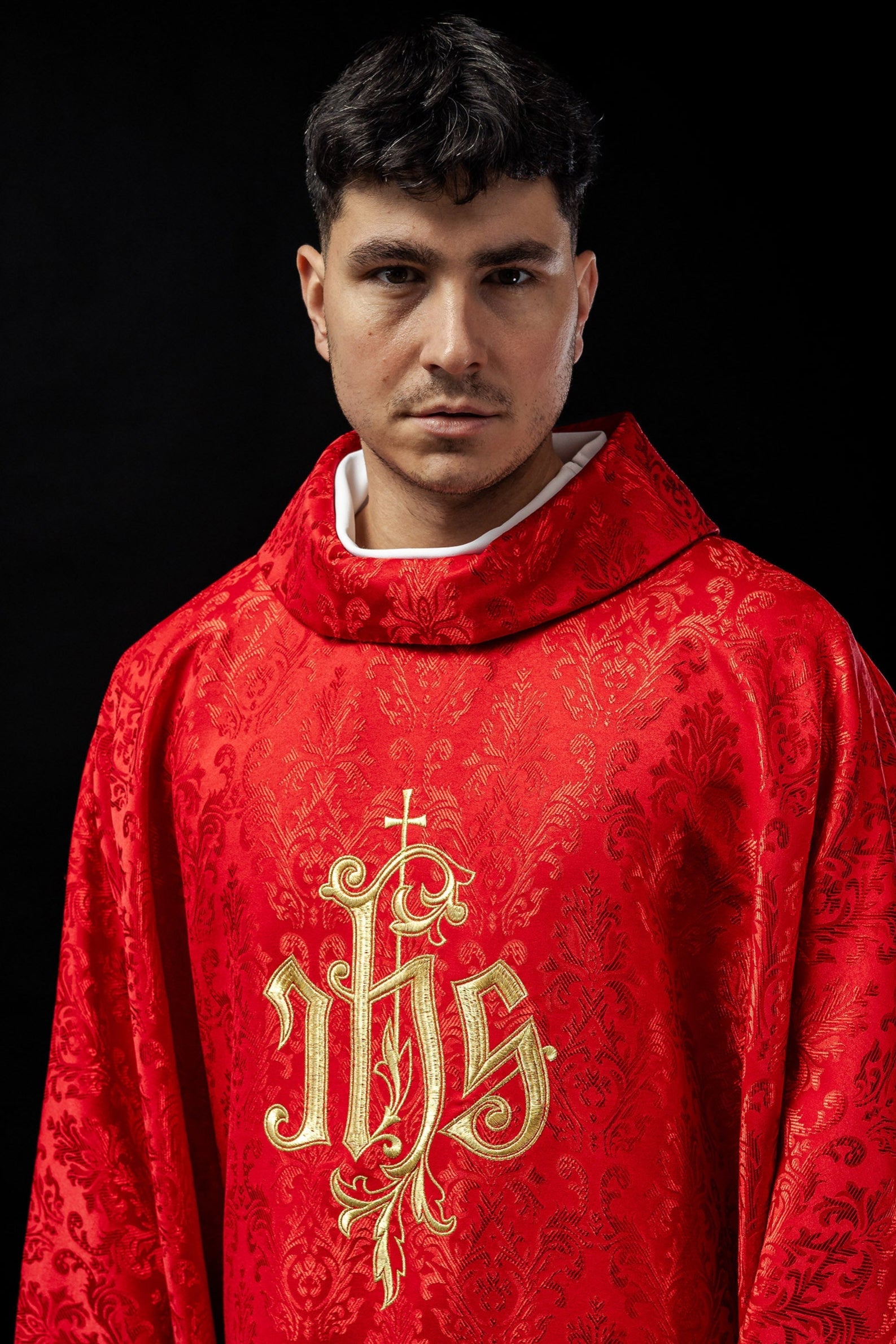 Red chasuble made of floral texture with classic IHS