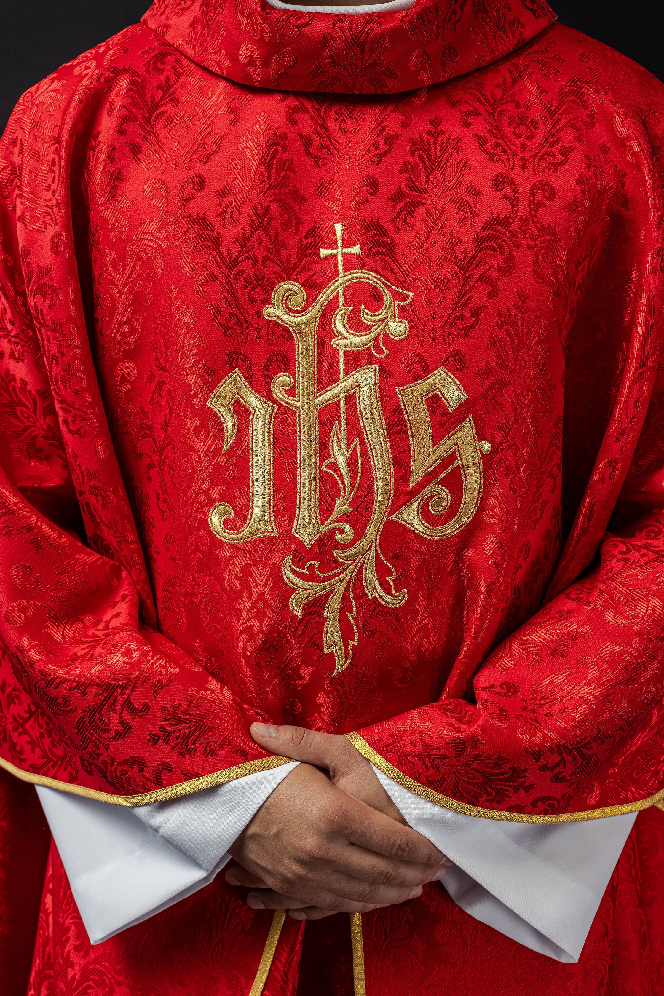 Red chasuble made of floral texture with classic IHS