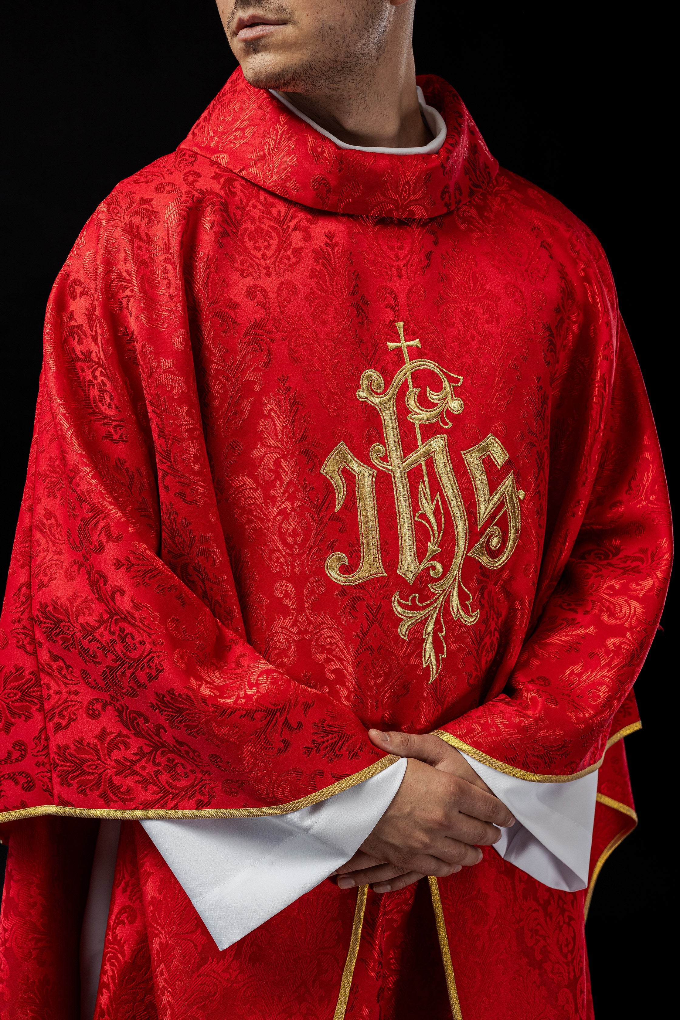 Red chasuble made of floral texture with classic IHS