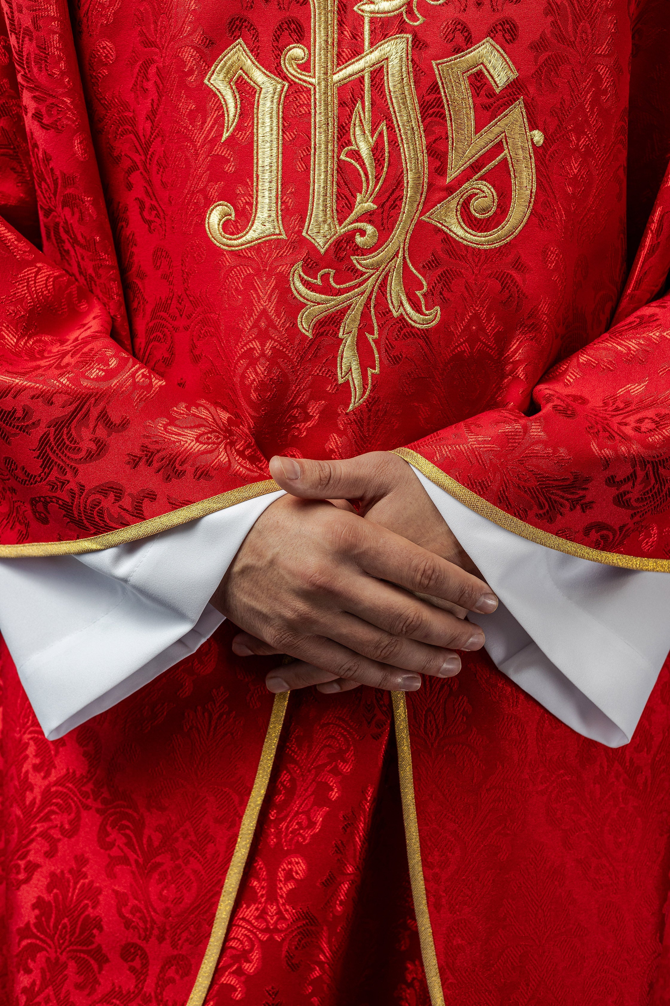 Red chasuble made of floral texture with classic IHS