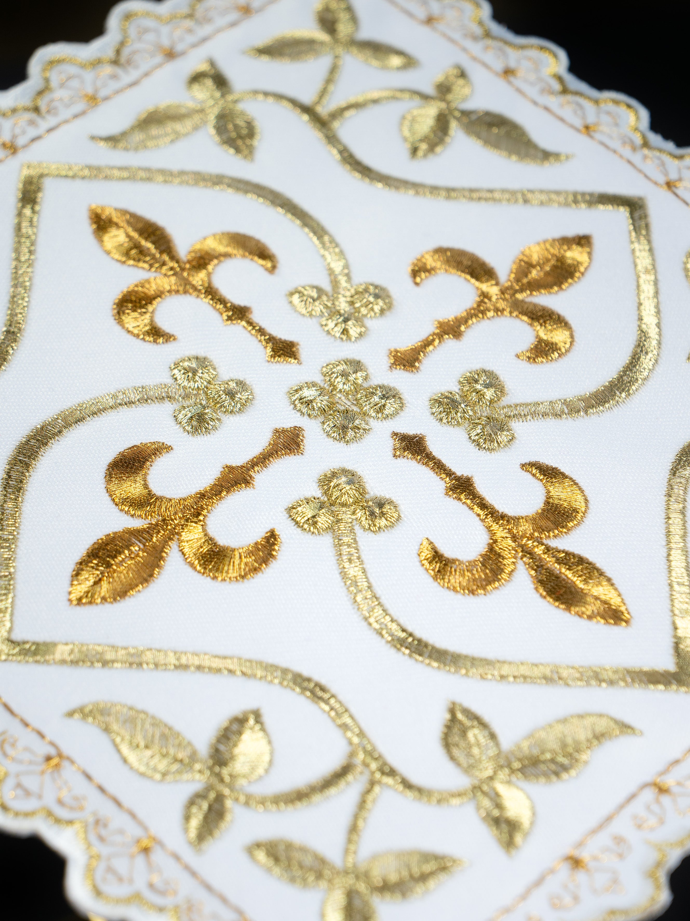 Altar linens with cross motif with gold embellishments and embroidered floral motif