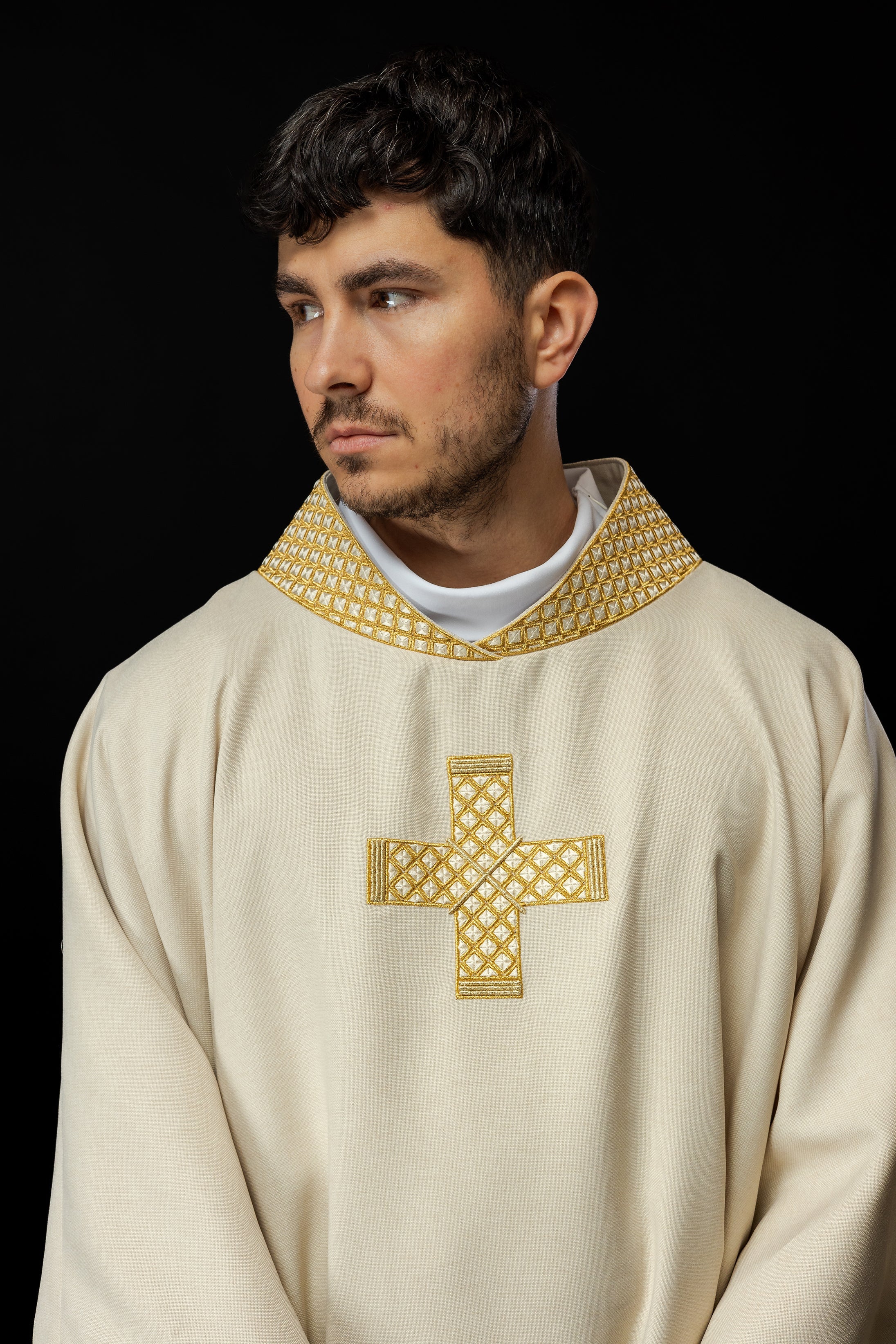 Ivory dalmatic with decorated gold collar and cross embroidery