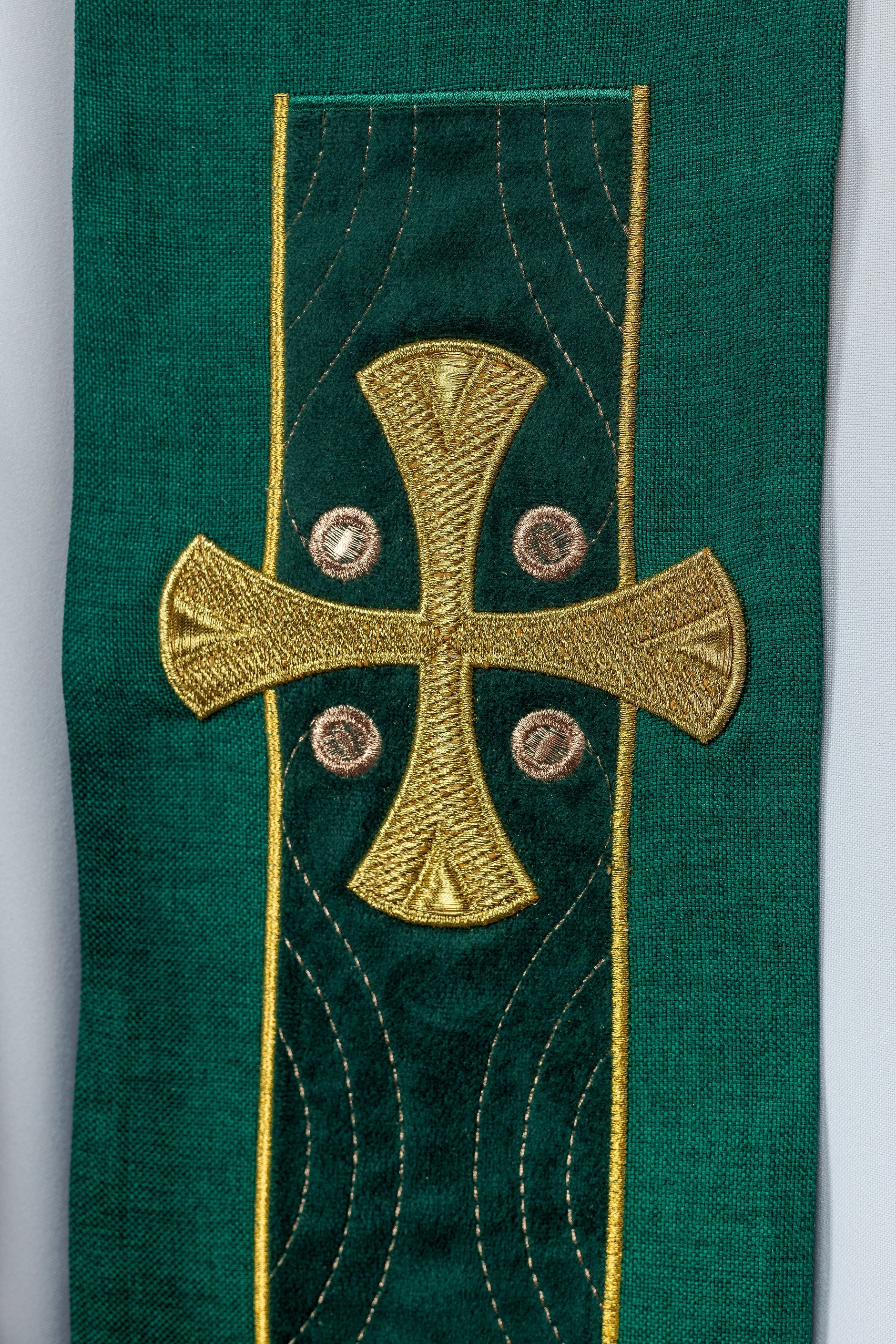 Modern green liturgical stole with three gold crosses and tassels