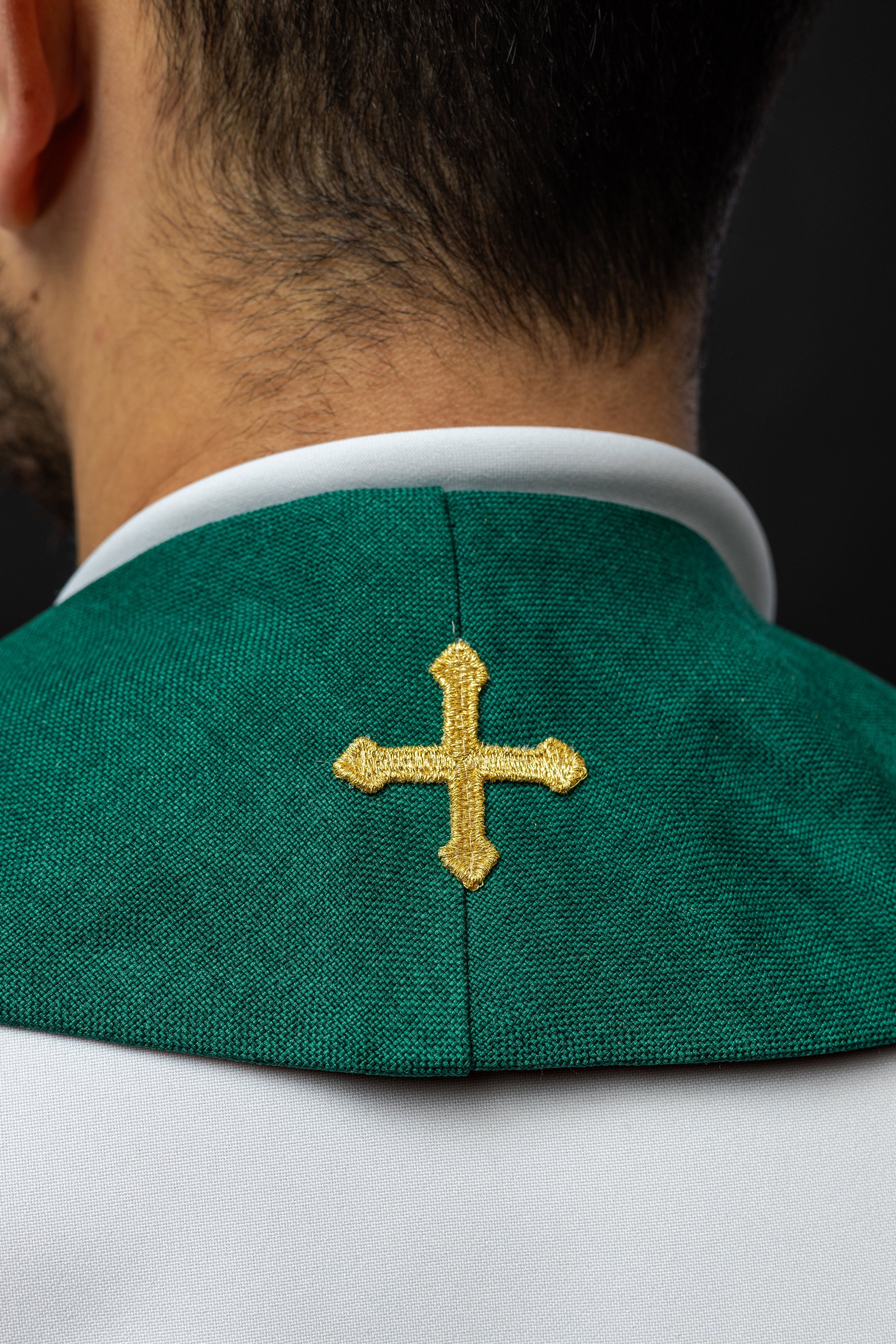 Modern green liturgical stole with three gold crosses and tassels