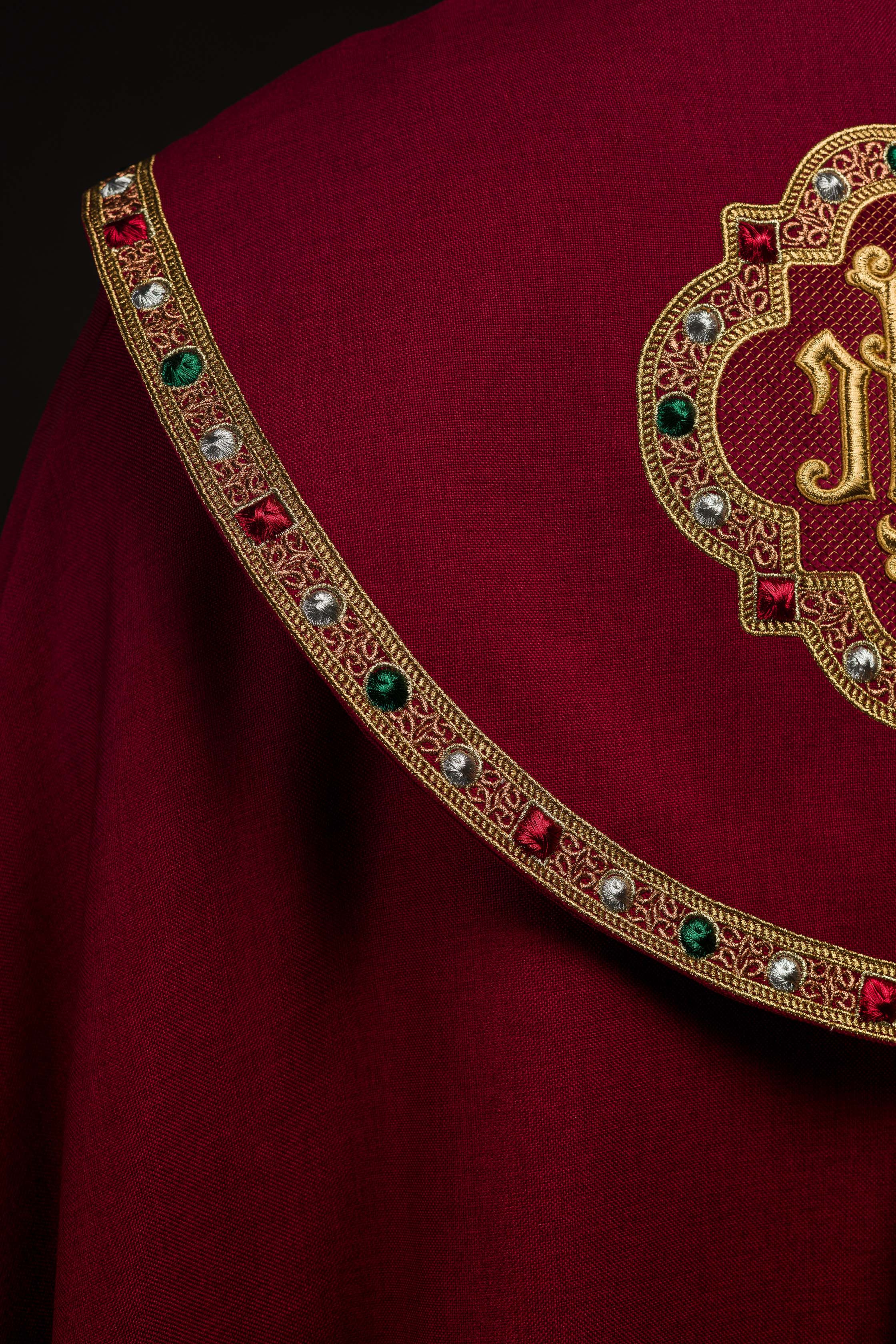 Liturgical cope in red finished with JHS embroidery
