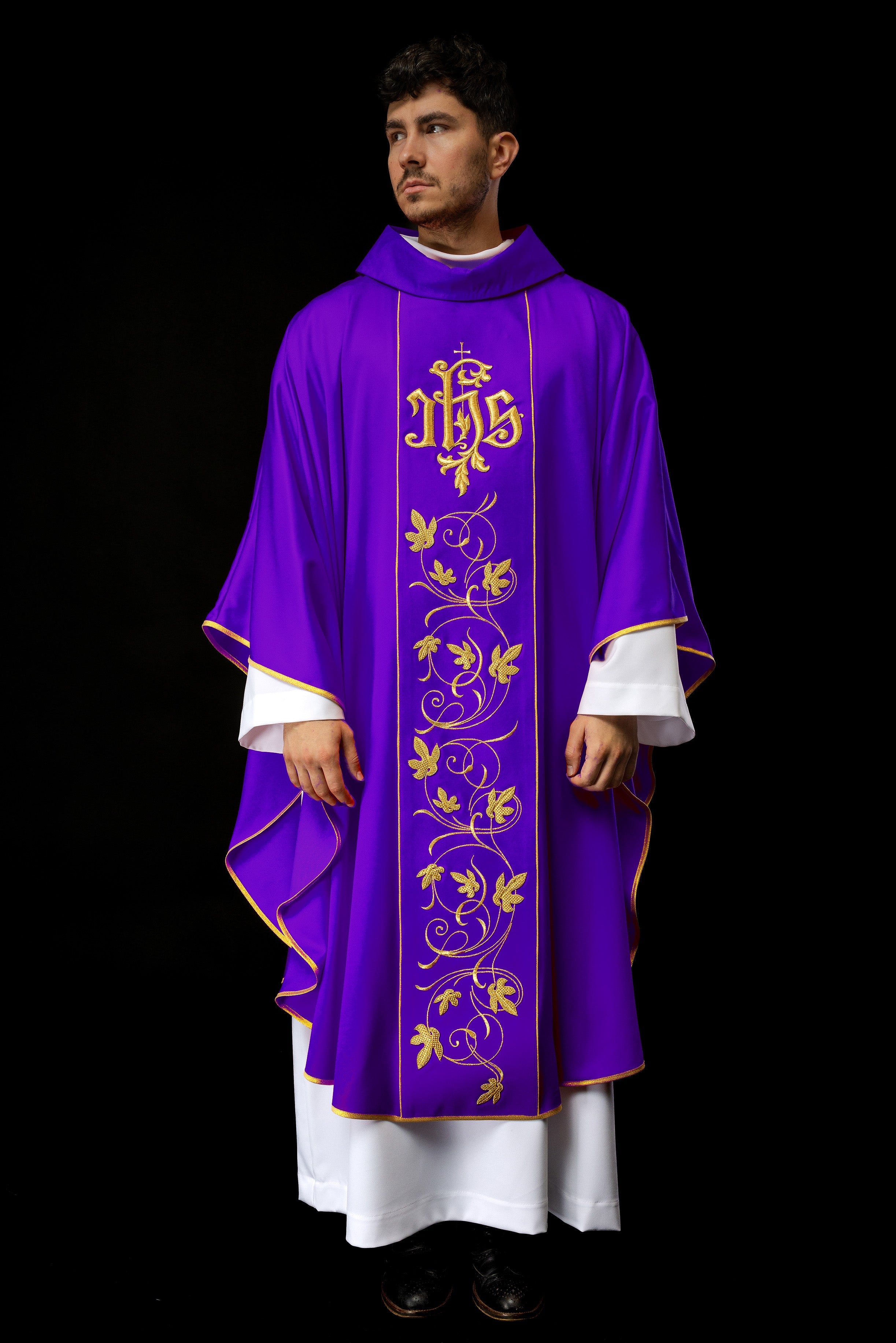 Purple liturgical chasuble with richly decorated belt with floral motif and IHS