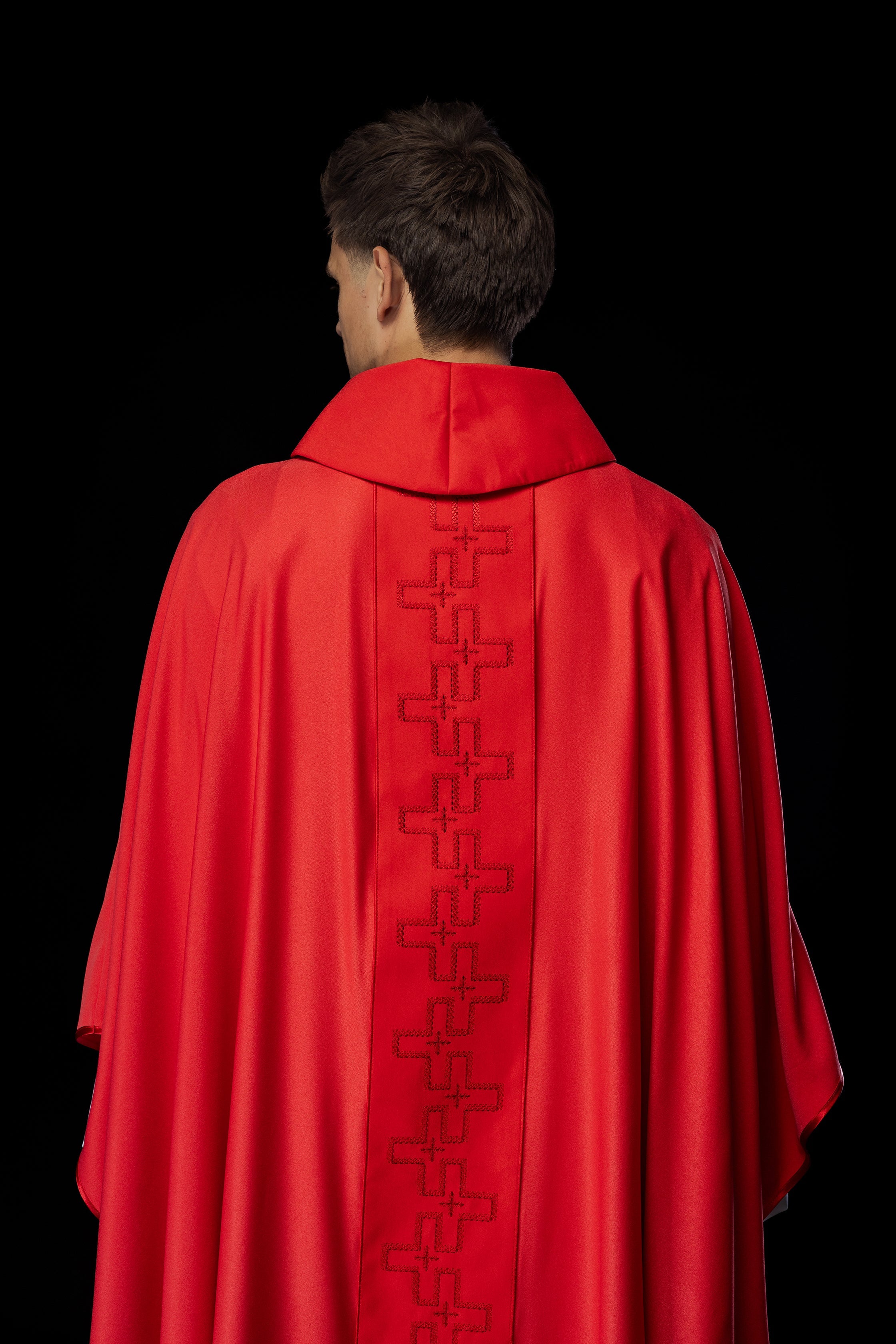 Catholic priest chasuble in red embroidery of crosses in red color