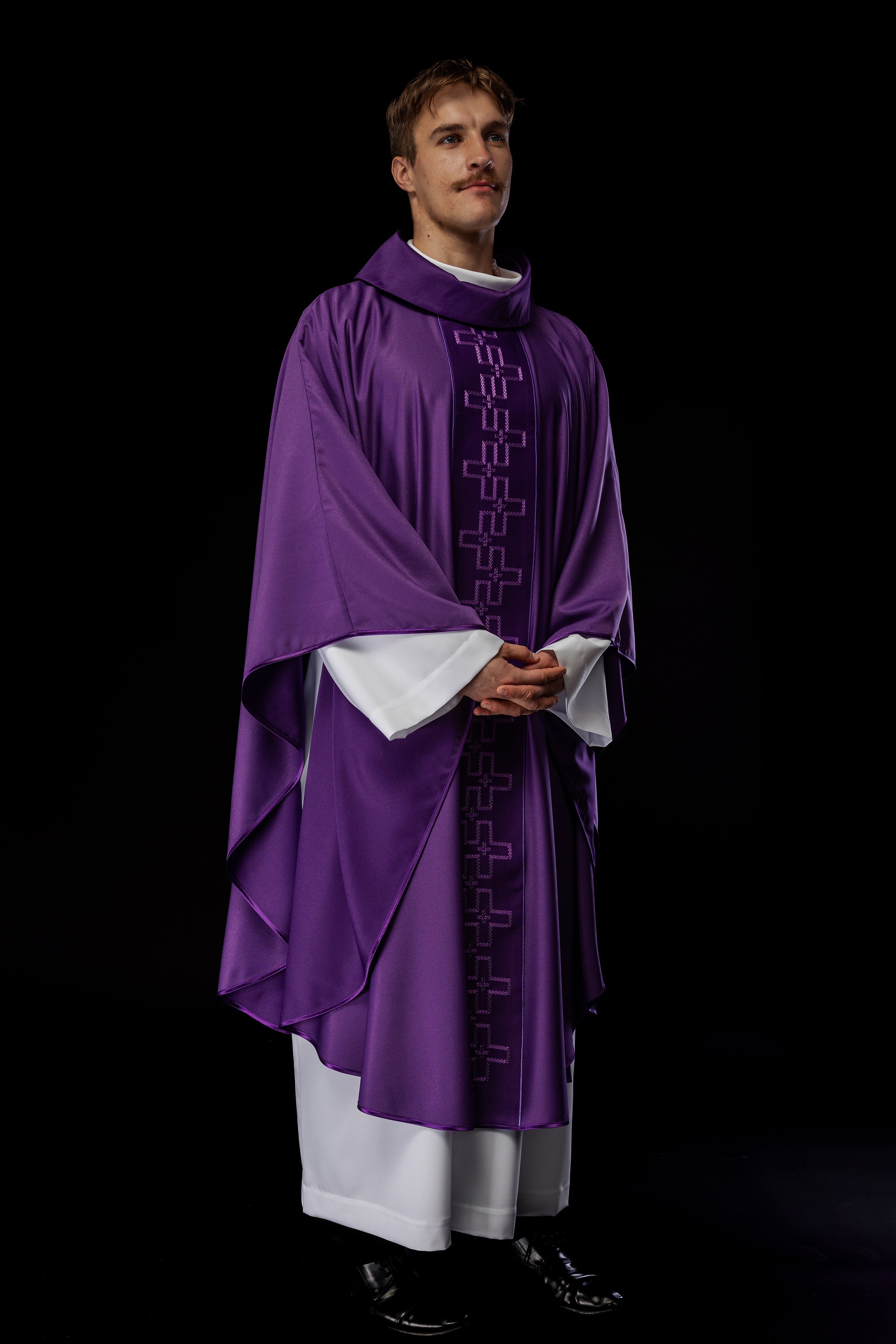 Chasuble with richly embroidered orphrey in embroidery of crosses in purple color