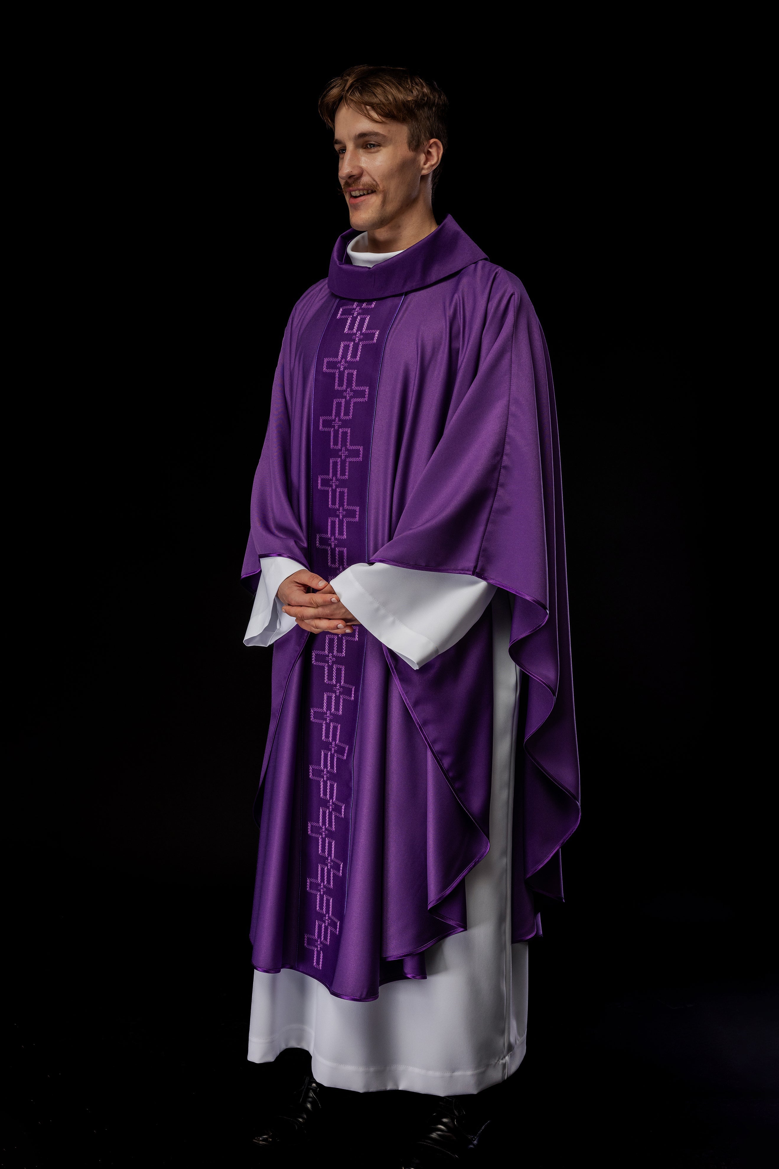 Chasuble with richly embroidered orphrey in embroidery of crosses in purple color