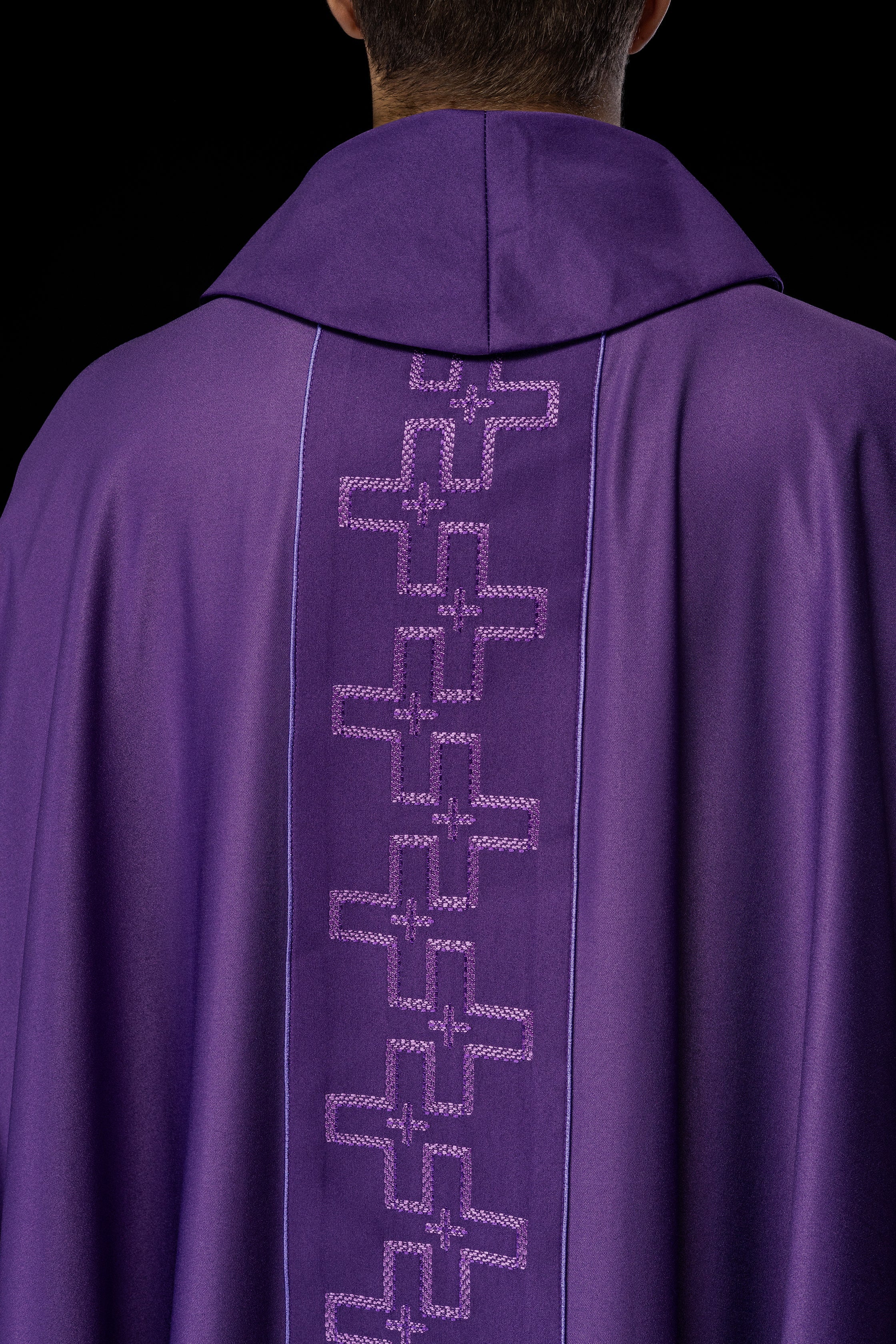 Chasuble with richly embroidered orphrey in embroidery of crosses in purple color