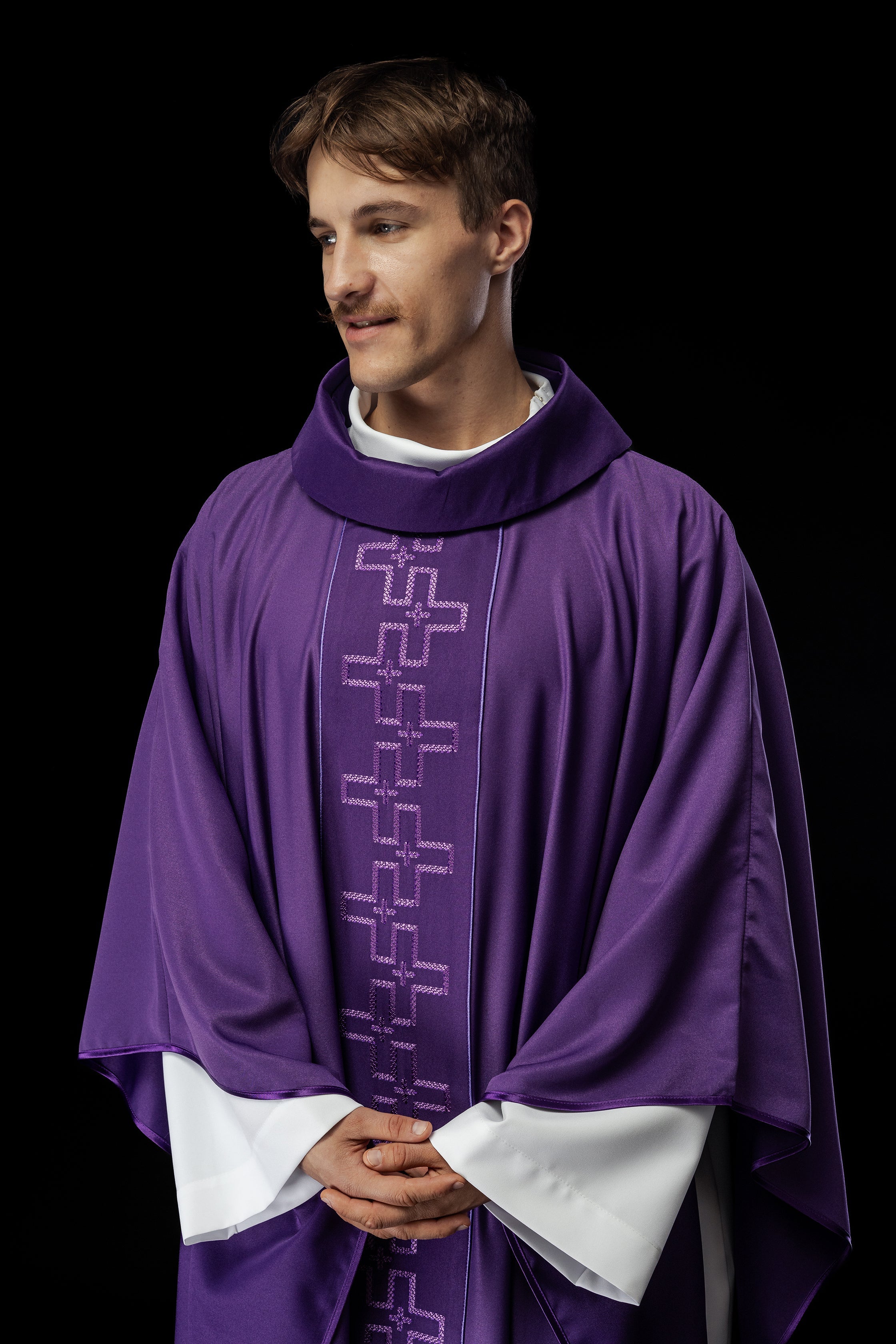 Chasuble with richly embroidered orphrey in embroidery of crosses in purple color