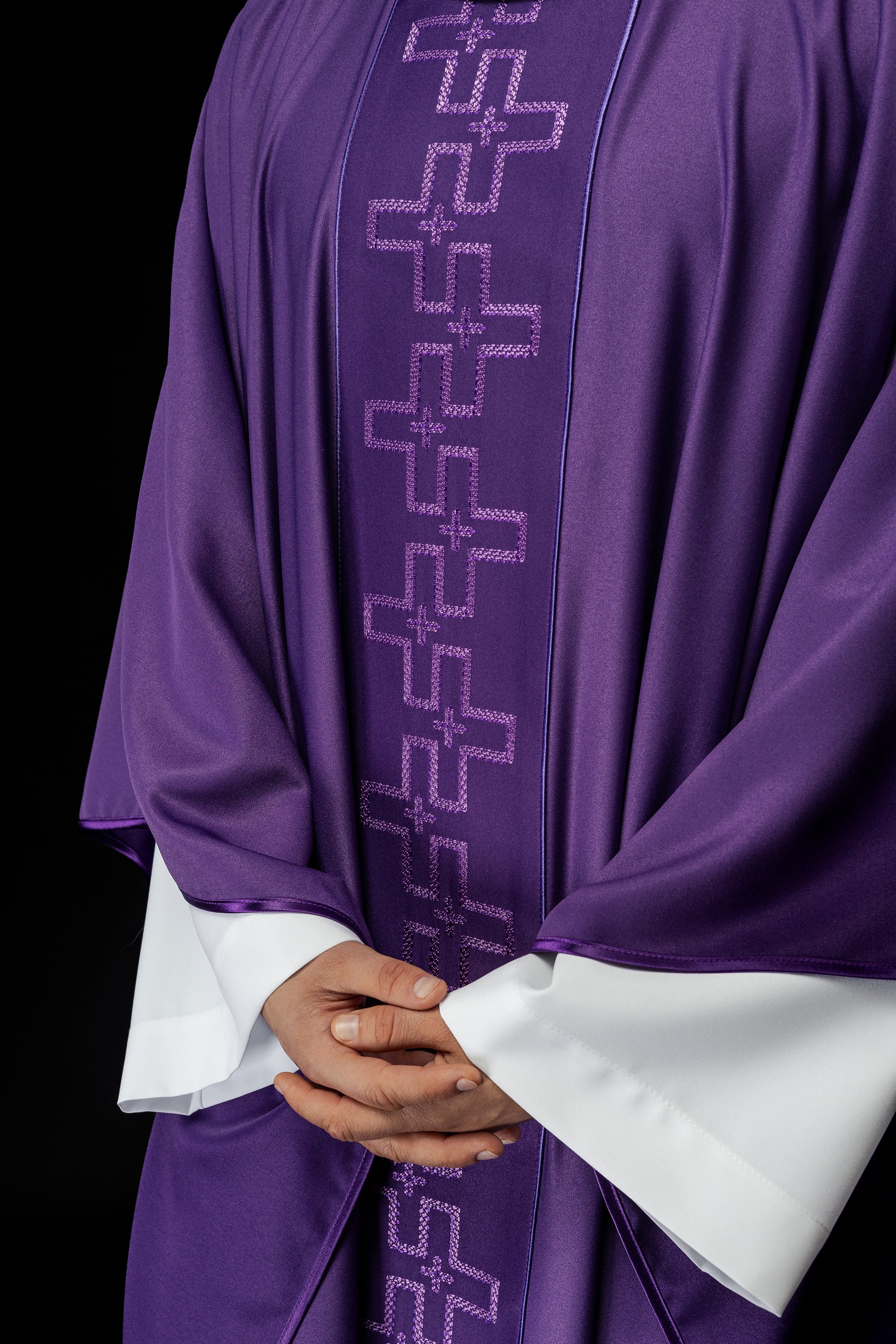 Chasuble with richly embroidered orphrey in embroidery of crosses in purple color