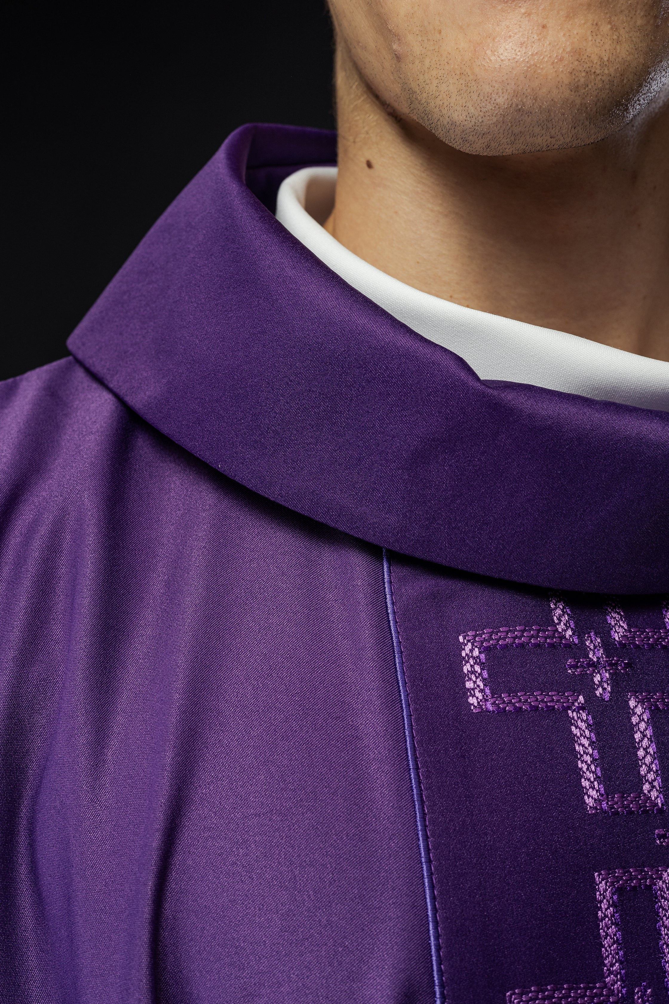 Chasuble with richly embroidered orphrey in embroidery of crosses in purple color