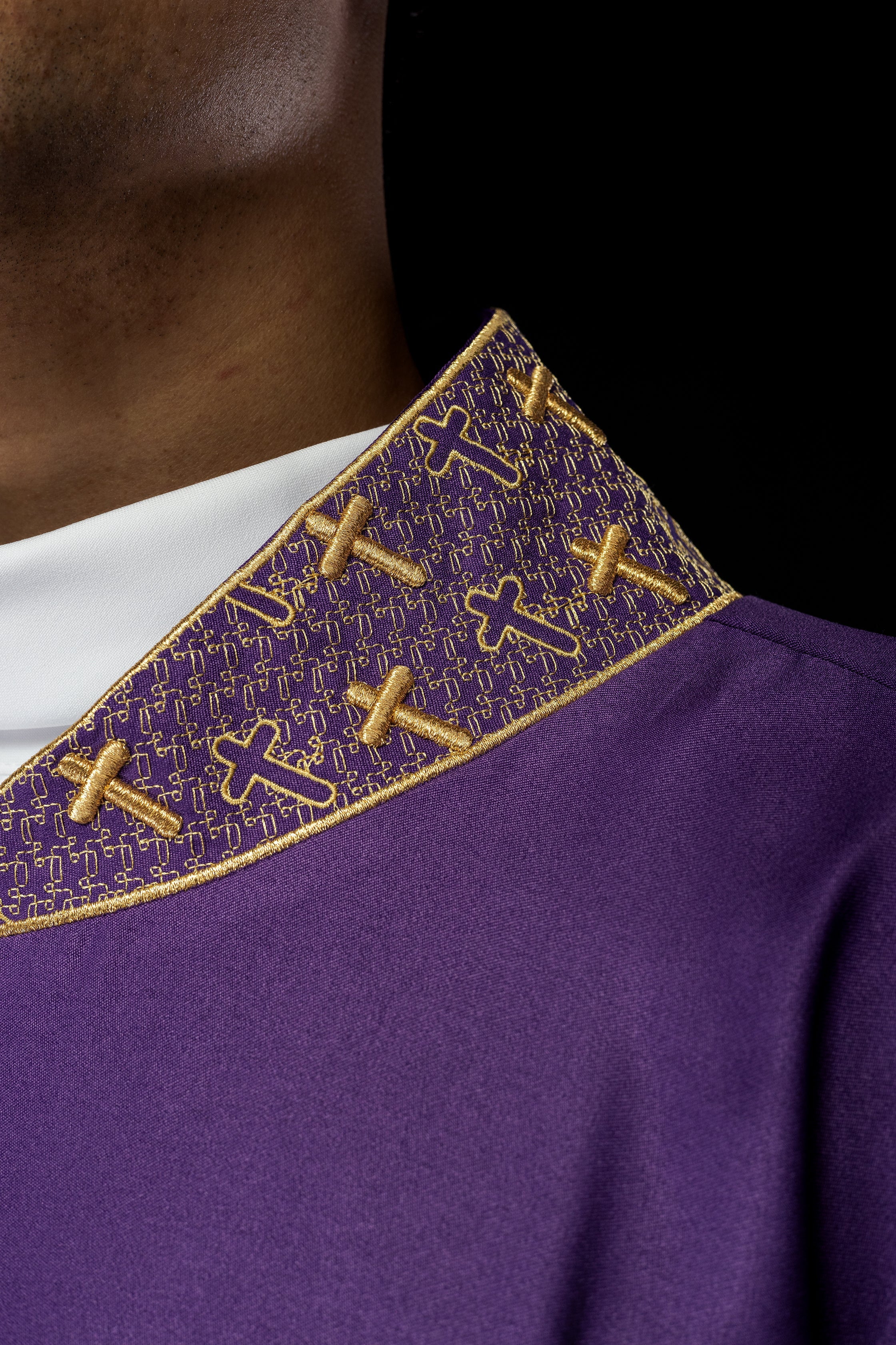 Purple chasuble with gold collar and cross embroidery