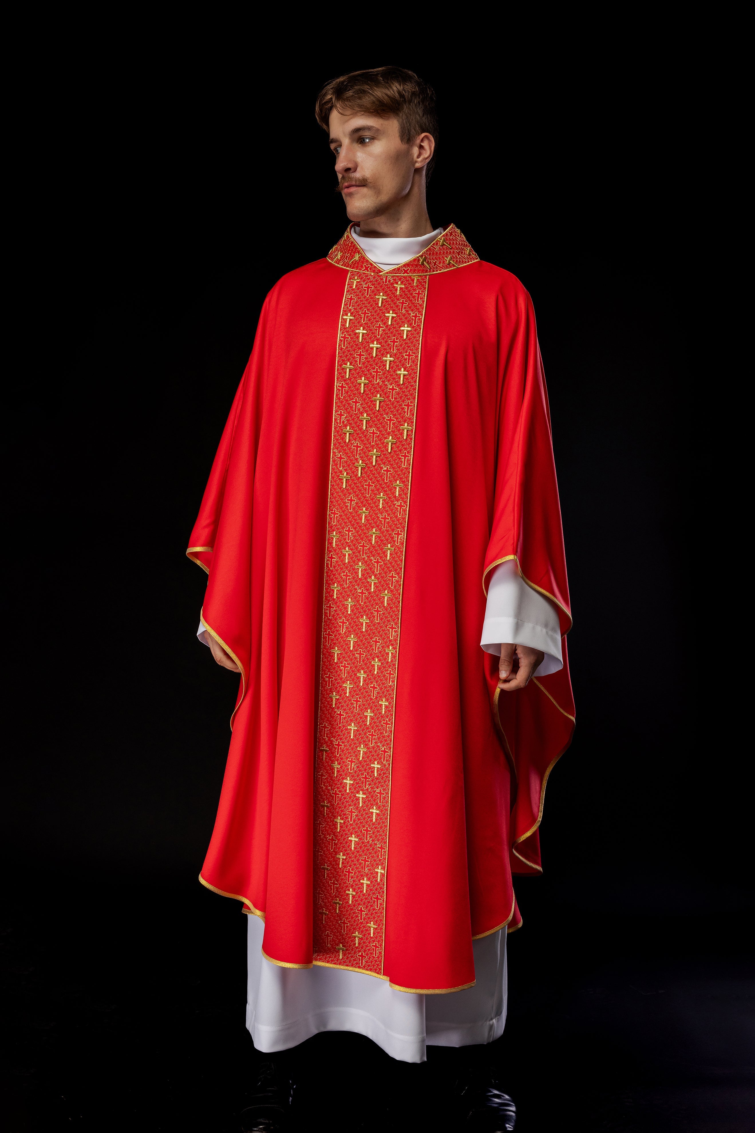 Red chasuble with gold cross embroidery on wide orphrey and collar