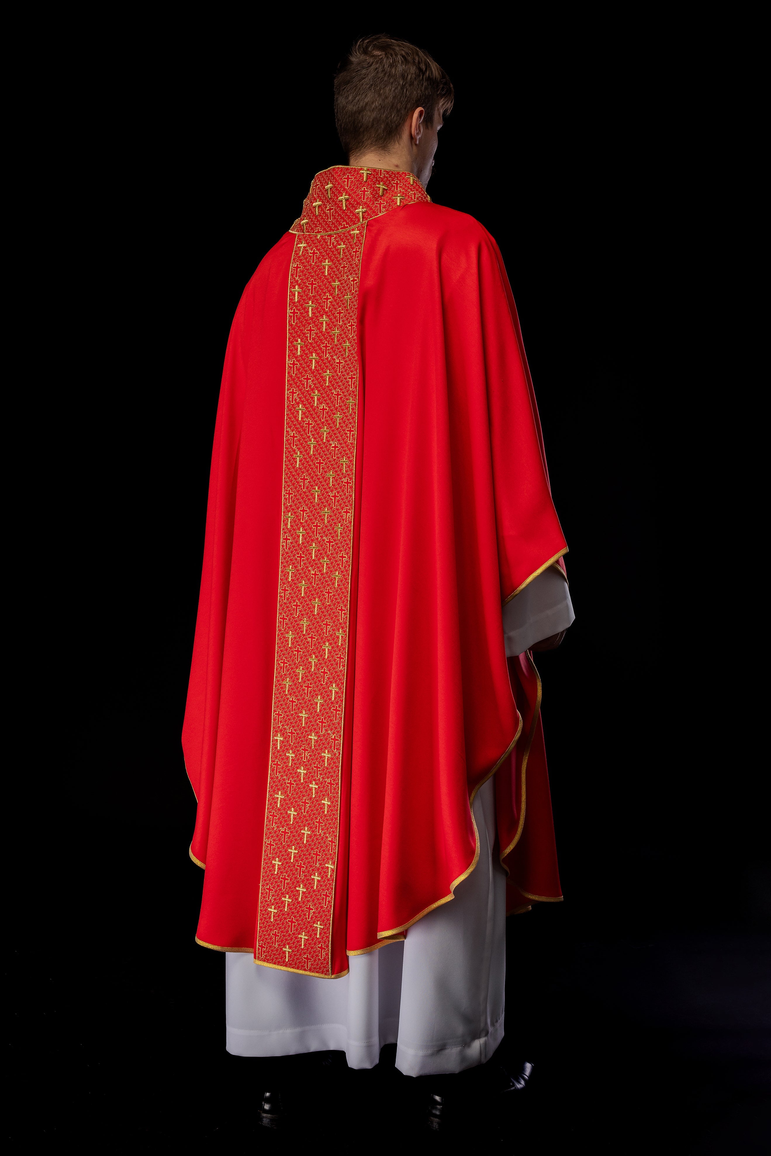 Red chasuble with gold cross embroidery on wide orphrey and collar