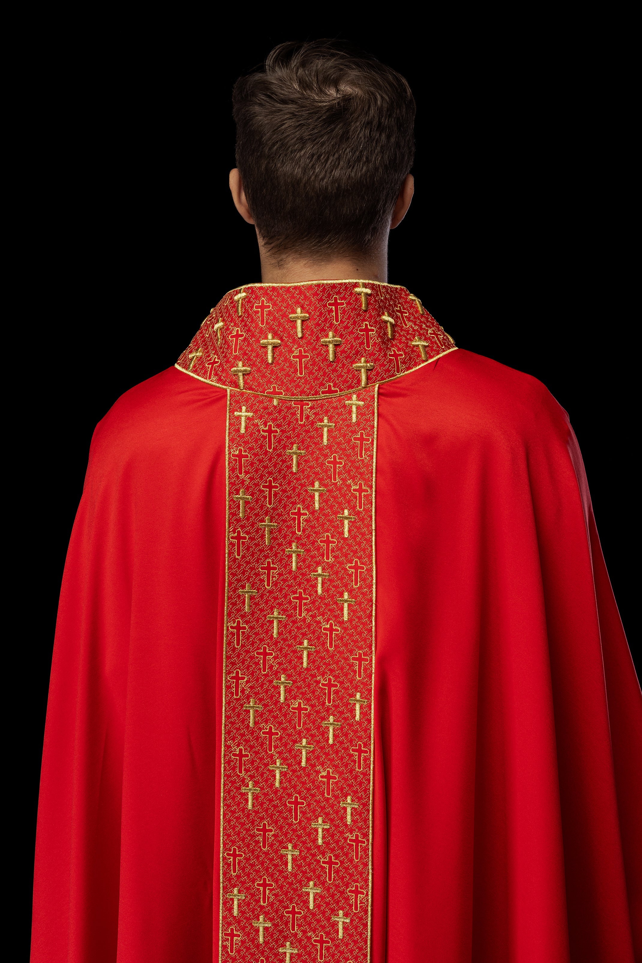 Red chasuble with gold cross embroidery on wide orphrey and collar