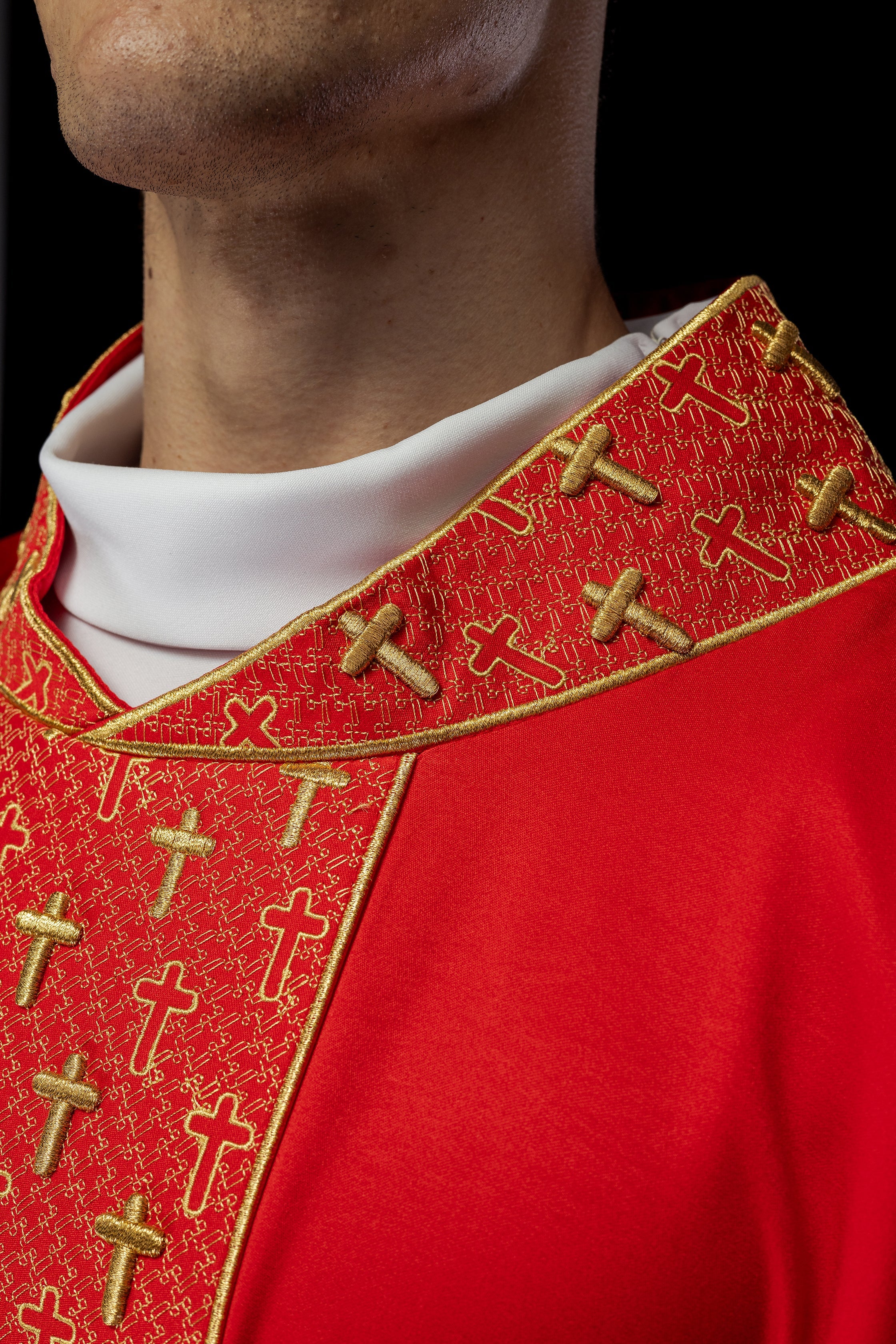 Red chasuble with gold cross embroidery on wide orphrey and collar