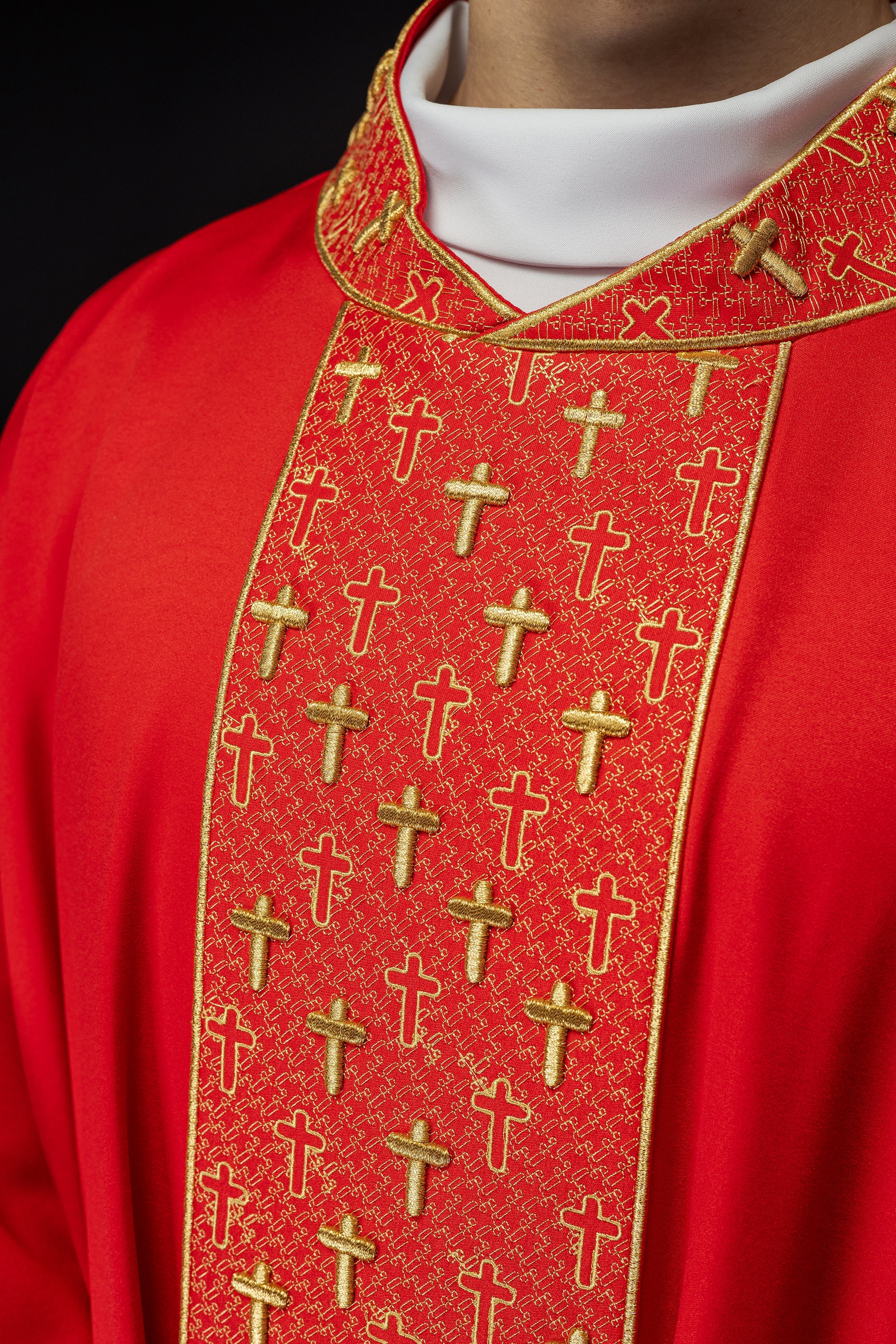 Red chasuble with gold cross embroidery on wide orphrey and collar