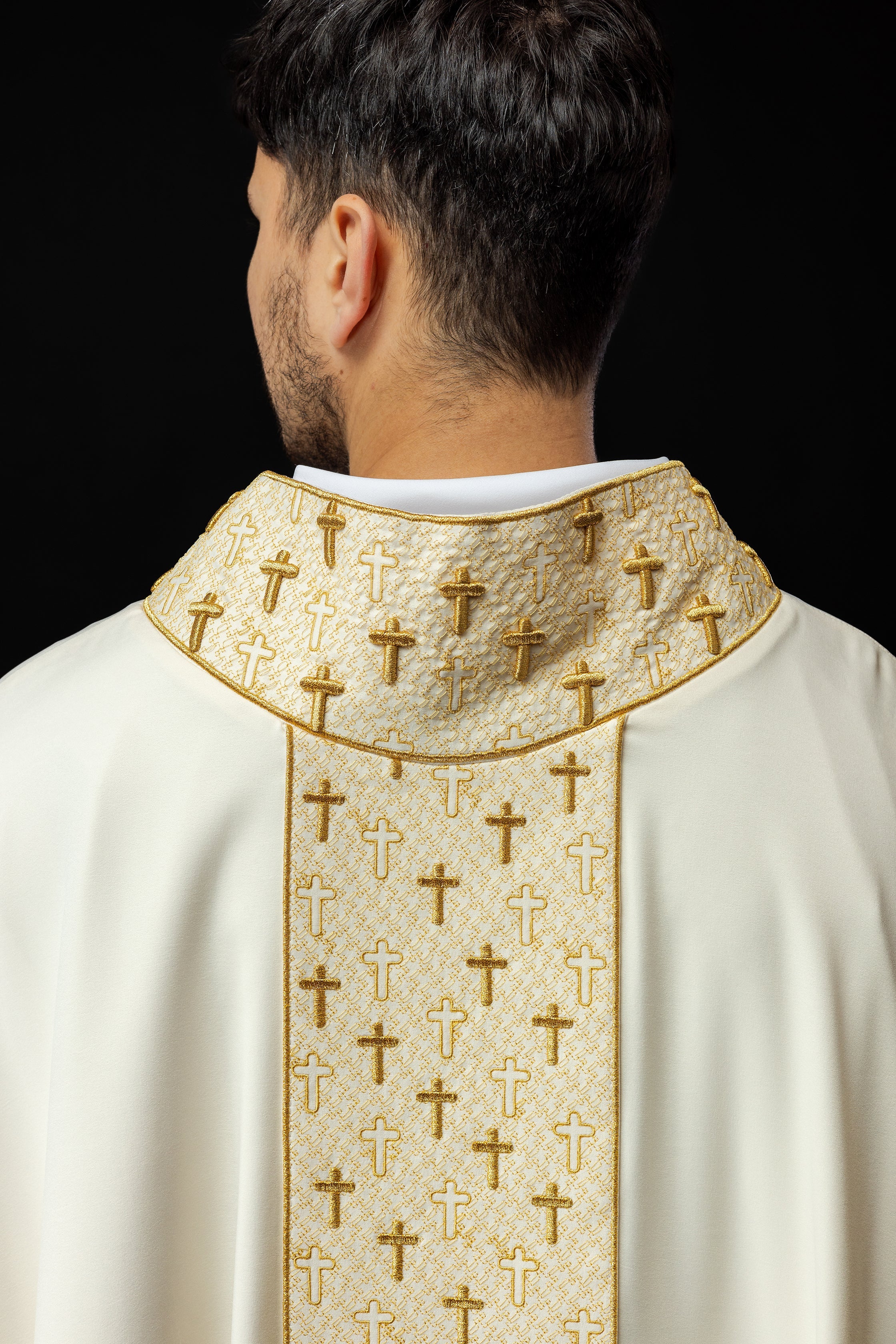 Cream liturgical chasuble with small gold crosses embroidery