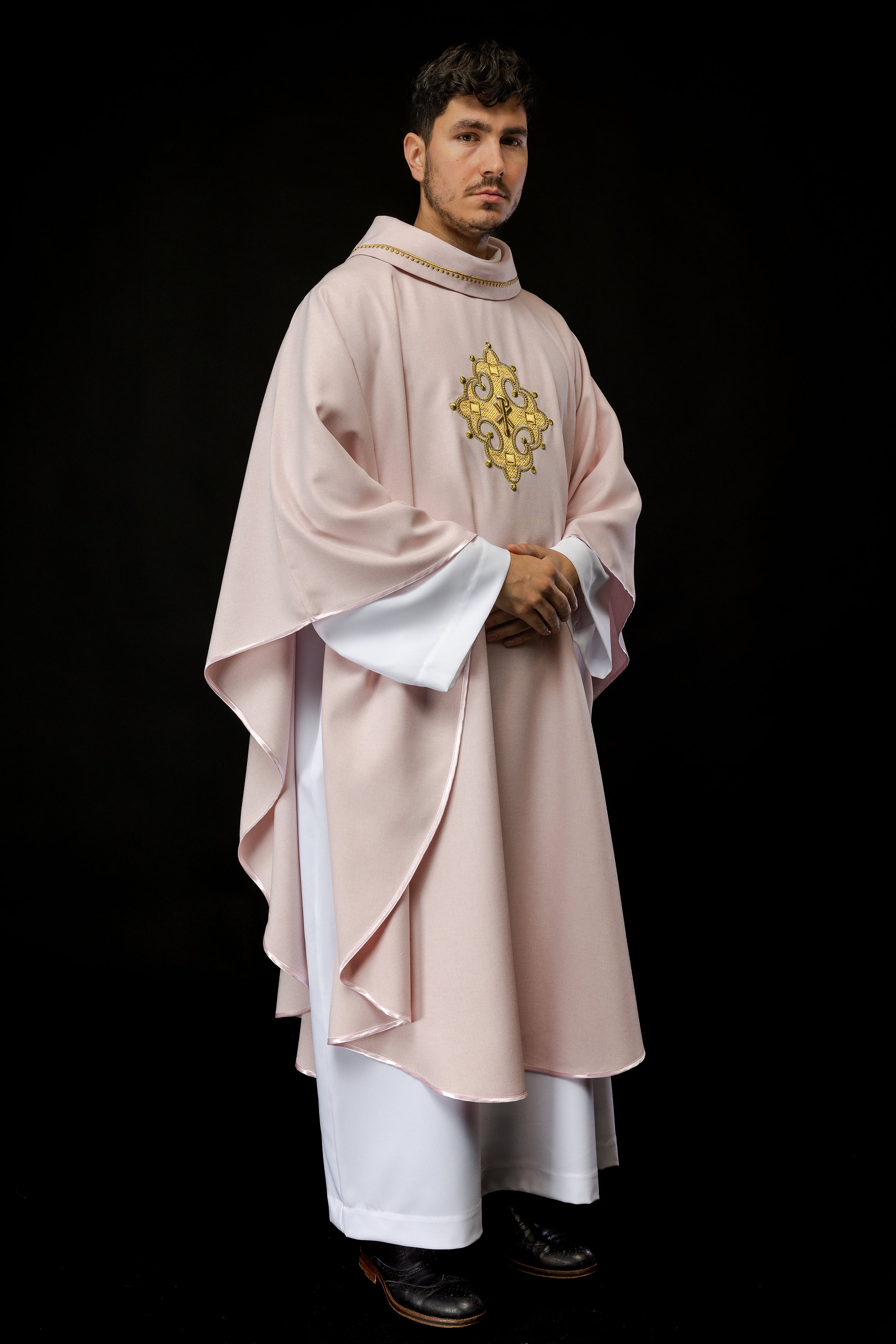 Simple pink chasuble with small PAX motif embroidery